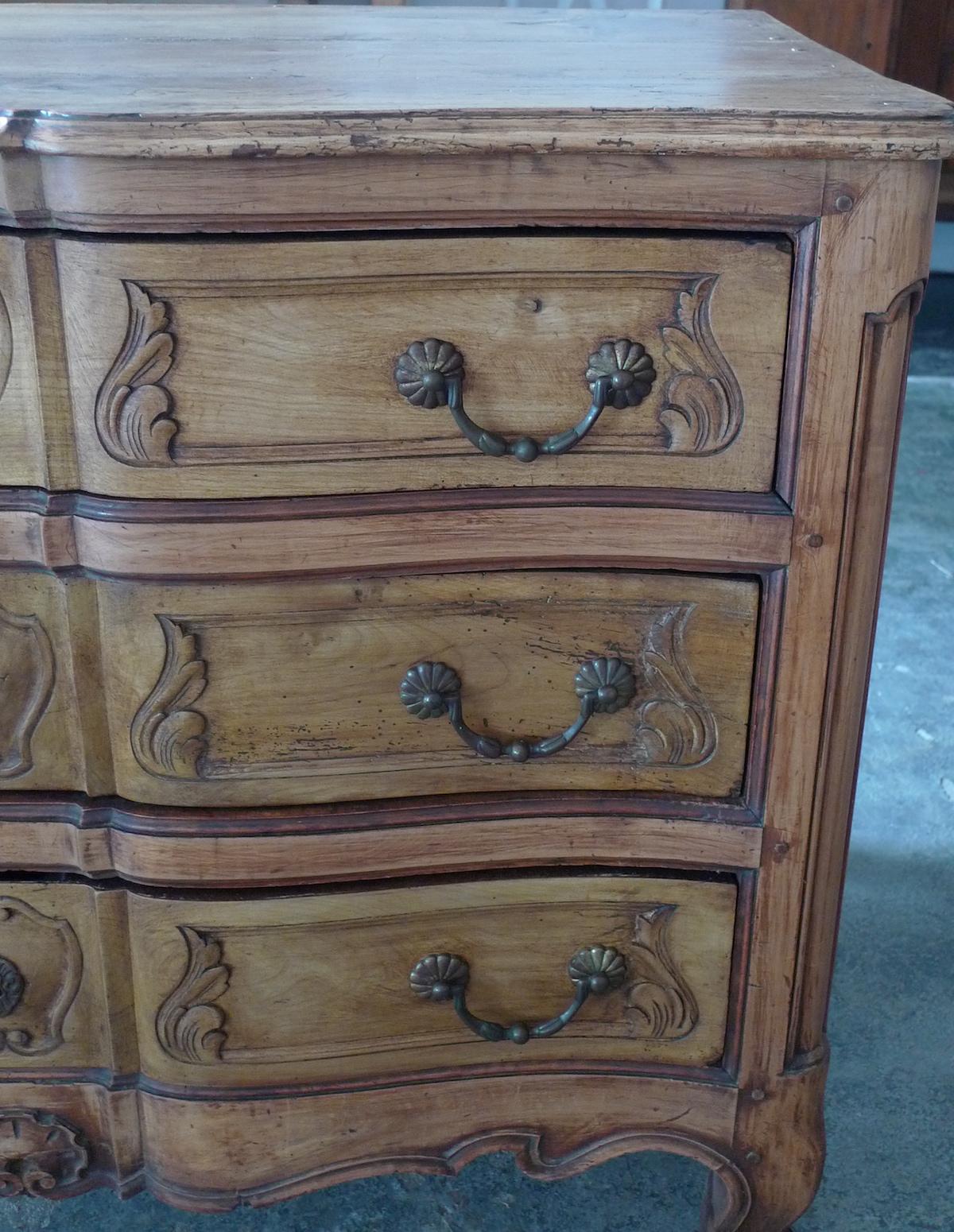 French 19th century Louis XV hand carved walnut commode-chest which is serpentine fronted has three drawers, moulded edges and original hardware.