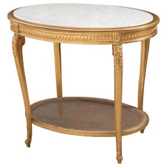 Mesa auxiliar ovalada de madera dorada estilo Luis XVI francés del siglo XIX