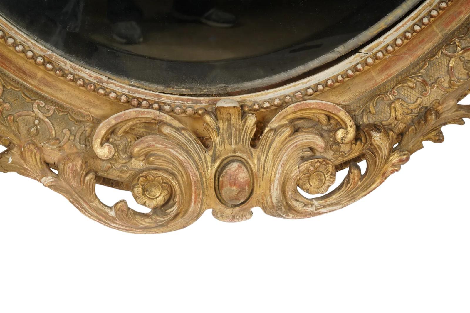 French Provincial French 19thc  Giltwood Oval Wall Mirror For Sale