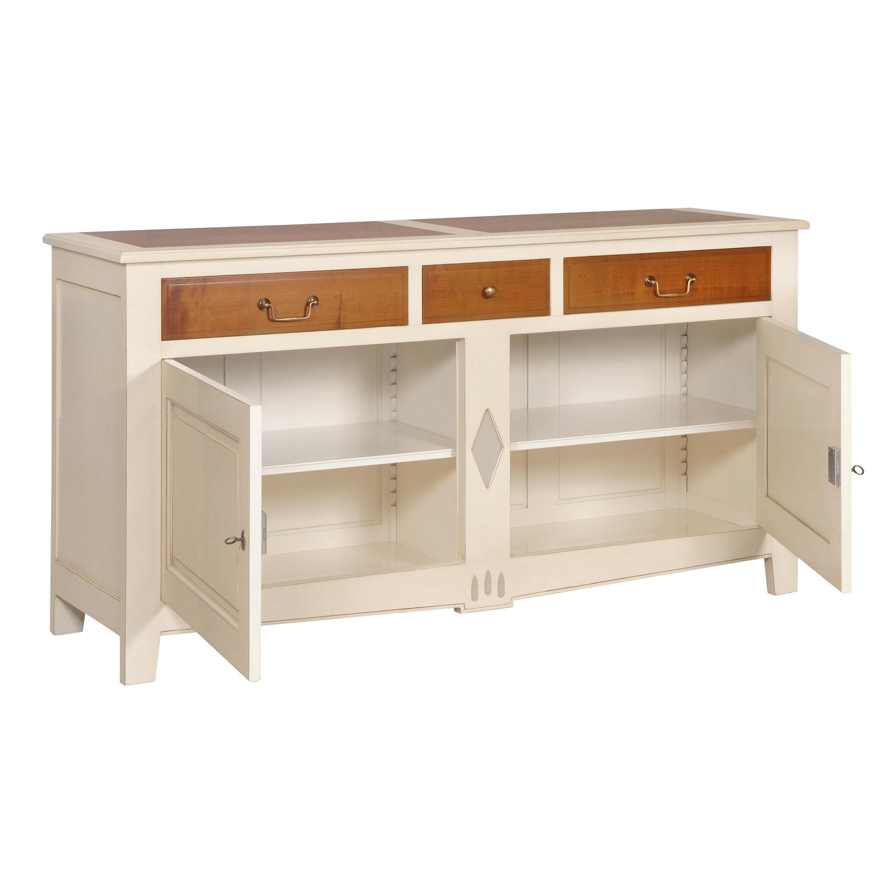 This 2 doors sideboard is a handmade and modernized interpretation of the French Directoire style at the end of the 18th century. This period is remarkable with its straight, classical and timeless lines.

This traditional buffet features 3