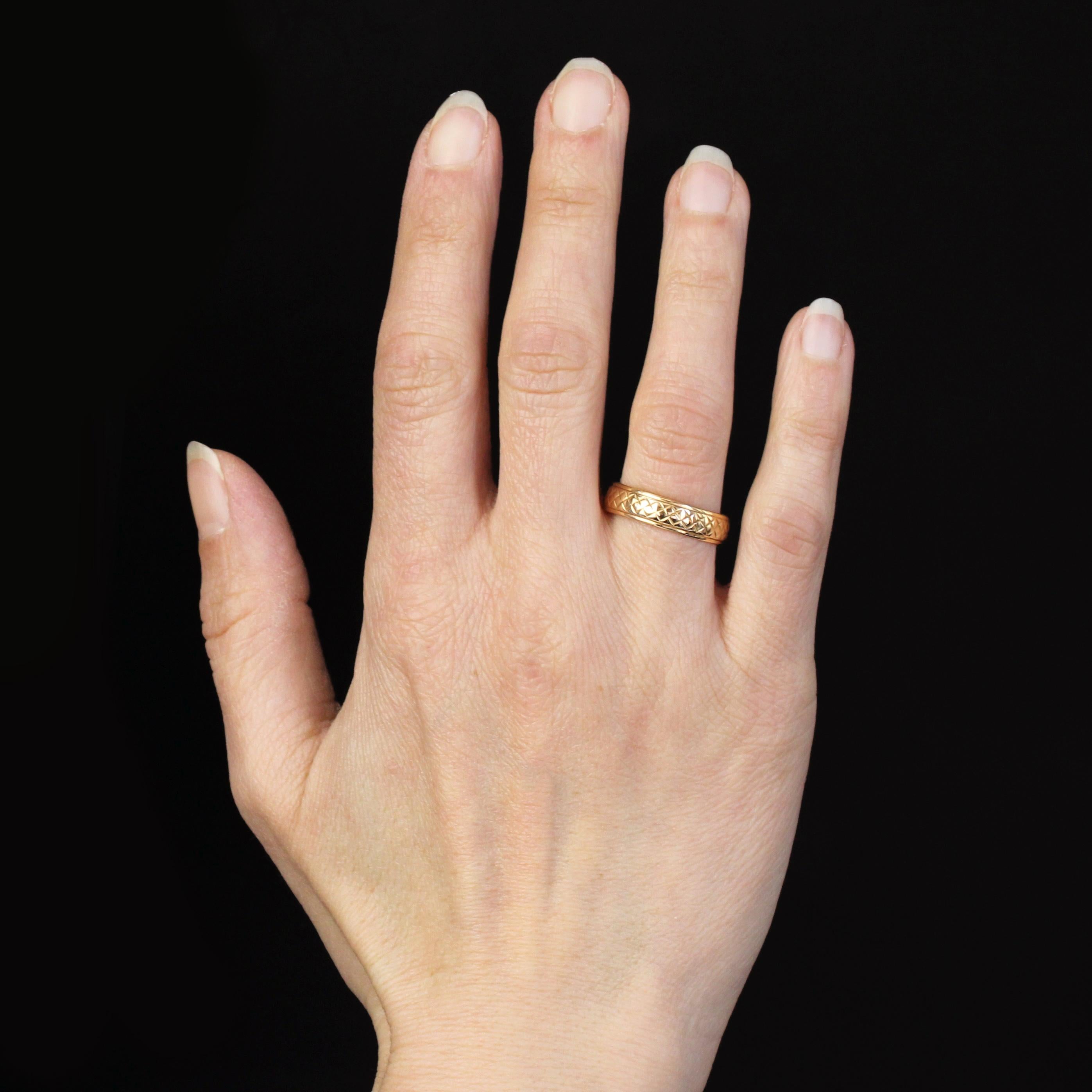 Ring in 18 karat rose gold, eagle head hallmark.
A slightly domed pink gold wedding band, it is decorated at regular intervals with star motifs and bordered all around by diamond-shaped motifs.
Width : 4.8 mm approximately, thickness : 1 mm
