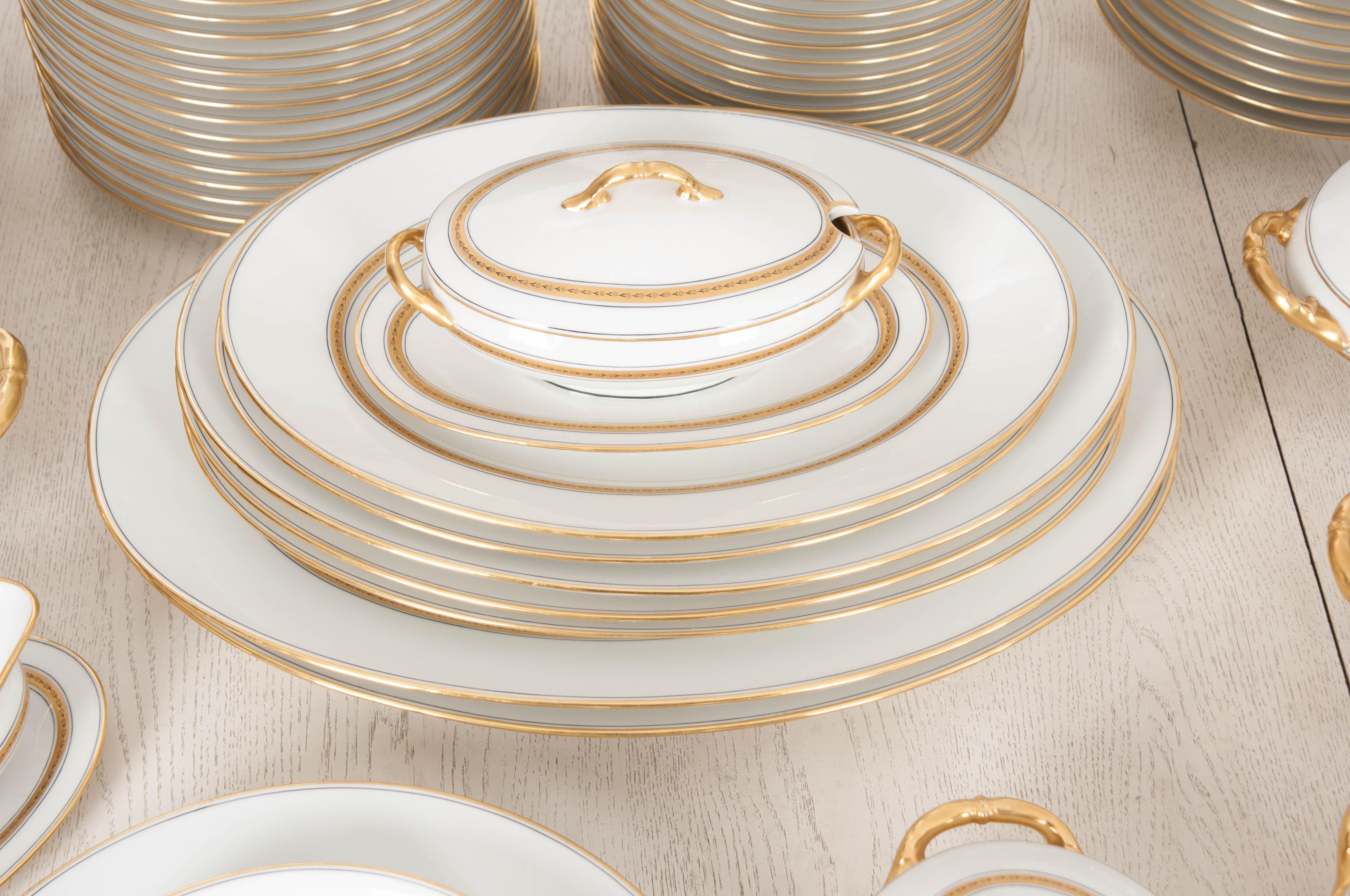 This fine Limoges porcelain 93-piece luncheon service with gilt banding, c.1910’s, was sold by the Dutch retailer, P.A.W. Philippona s’Gravenhage (The Hague), and so marked. The set also bears the Limoges mark of MC (script) within a triangle, each