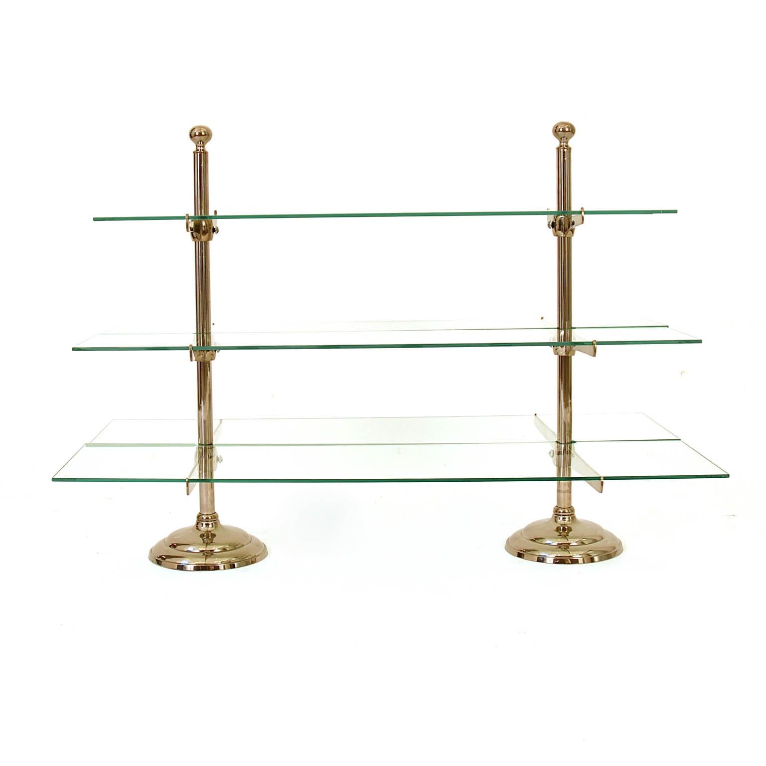 Beautiful and high quality 20th century Art Deco glass storage rack made in France. An elegant shop display carried by a nickel metal frame. Maybe for a confectionary étagère from a Pâtisserie, or to display valuables. The three metal holders can be