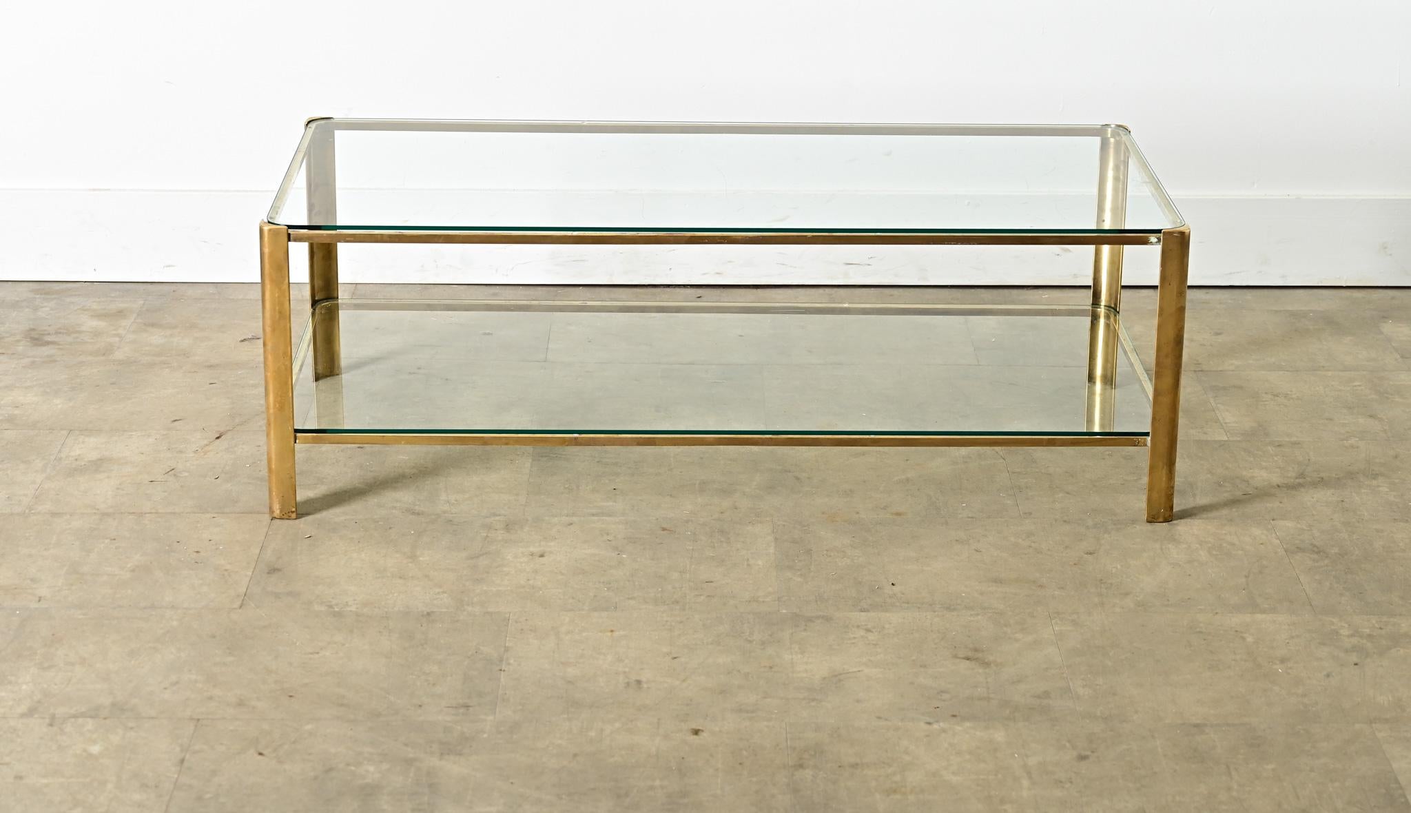This sleek rectangular coffee table was produced by the firm of Broncz in France in the 1960s, reflecting a new gilded age of French design after the war built on the Moderne tradition with glamorous flourishes a la Maison Baguès and Maison Janen.