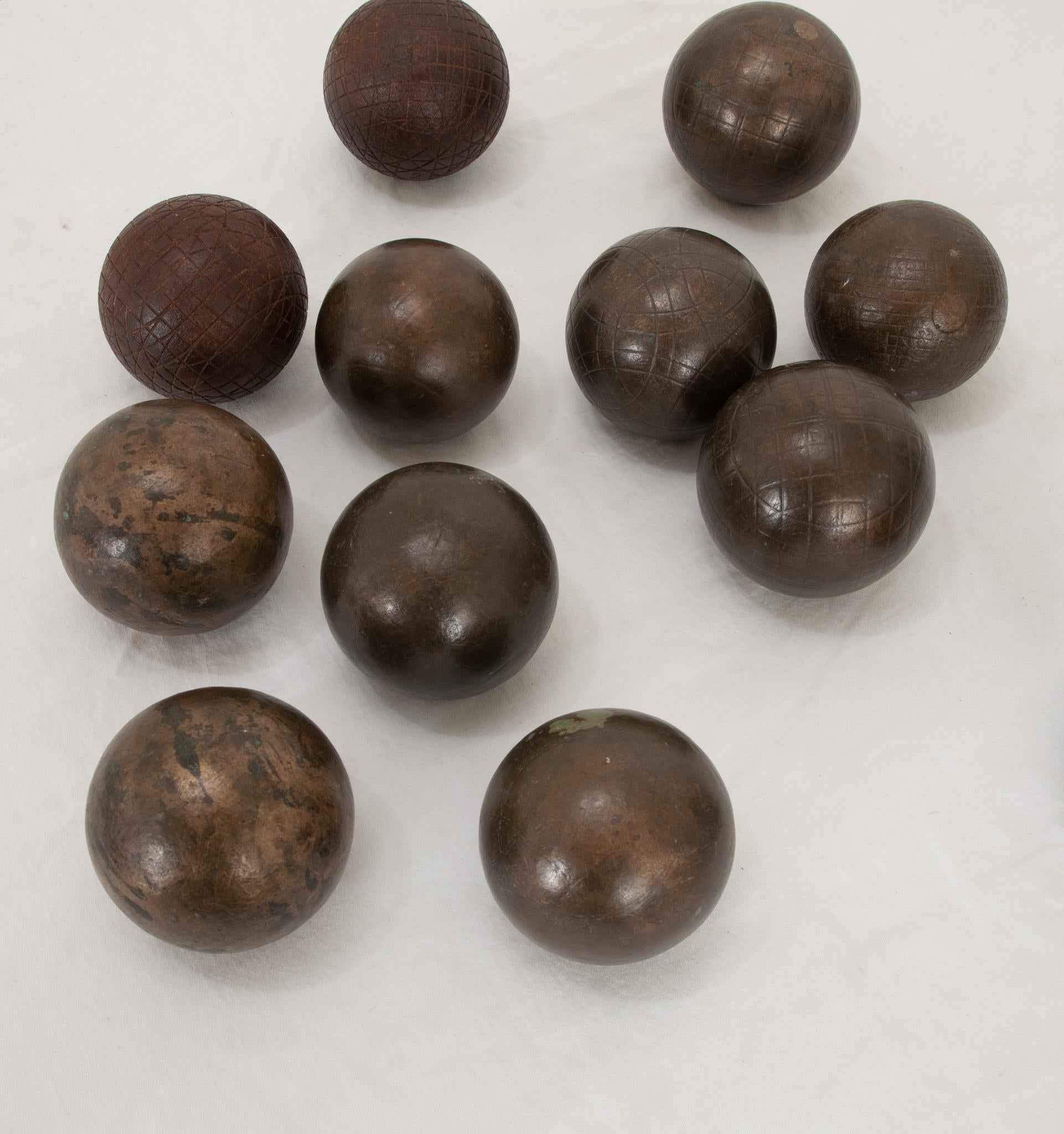 Cast French 20th Century Collection of 12 Boules For Sale