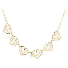 Collar drapeado francés de perlas cultivadas del siglo XX en oro amarillo de 18 quilates