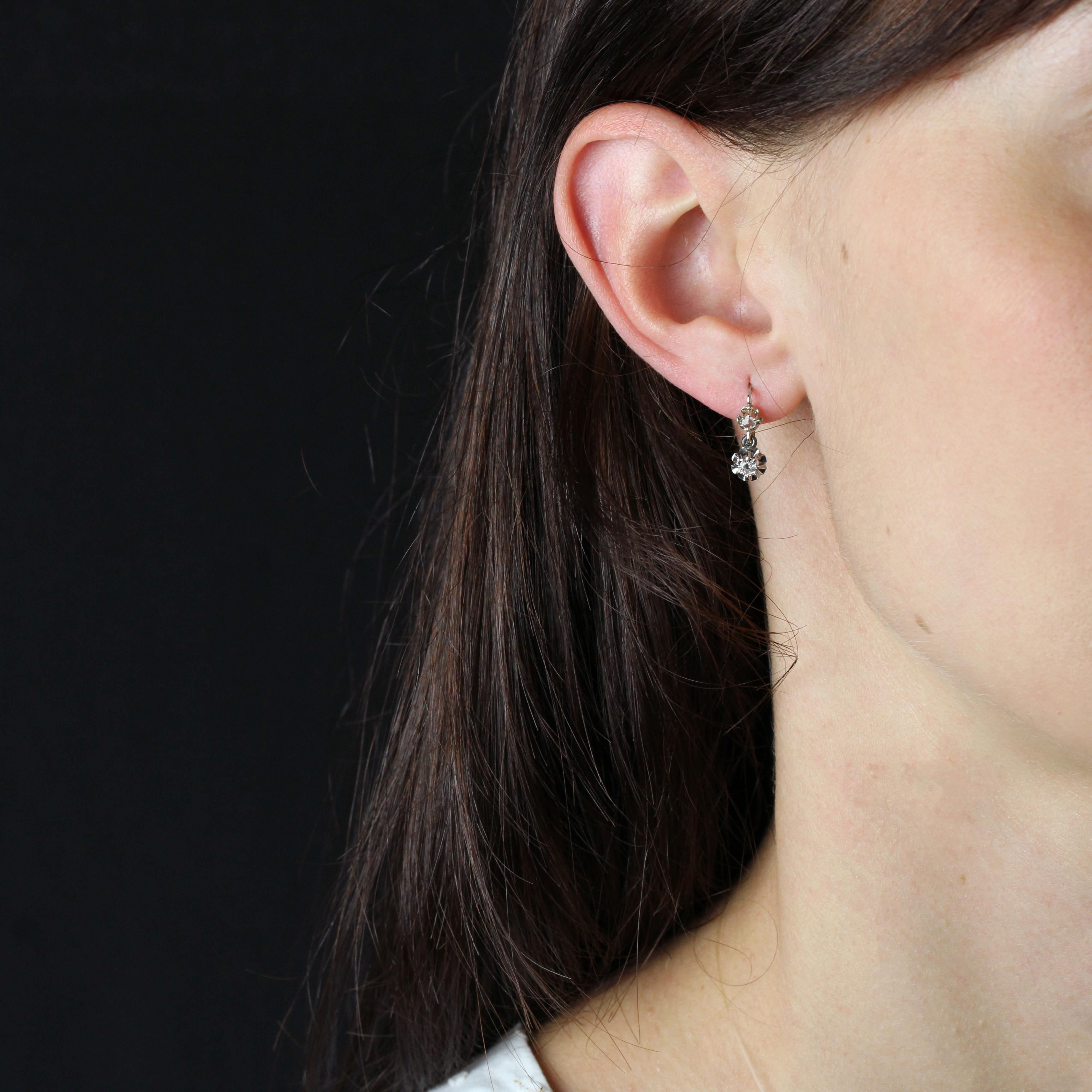 For pierced ears.
Earrings in 18 karat white gold, eagle head hallmark and platinum, dog head hallmark.
Fine antique earrings, set in white gold, slip on from the front. 1 antique brilliant-cut diamond is held in platinum claws on each and topped by