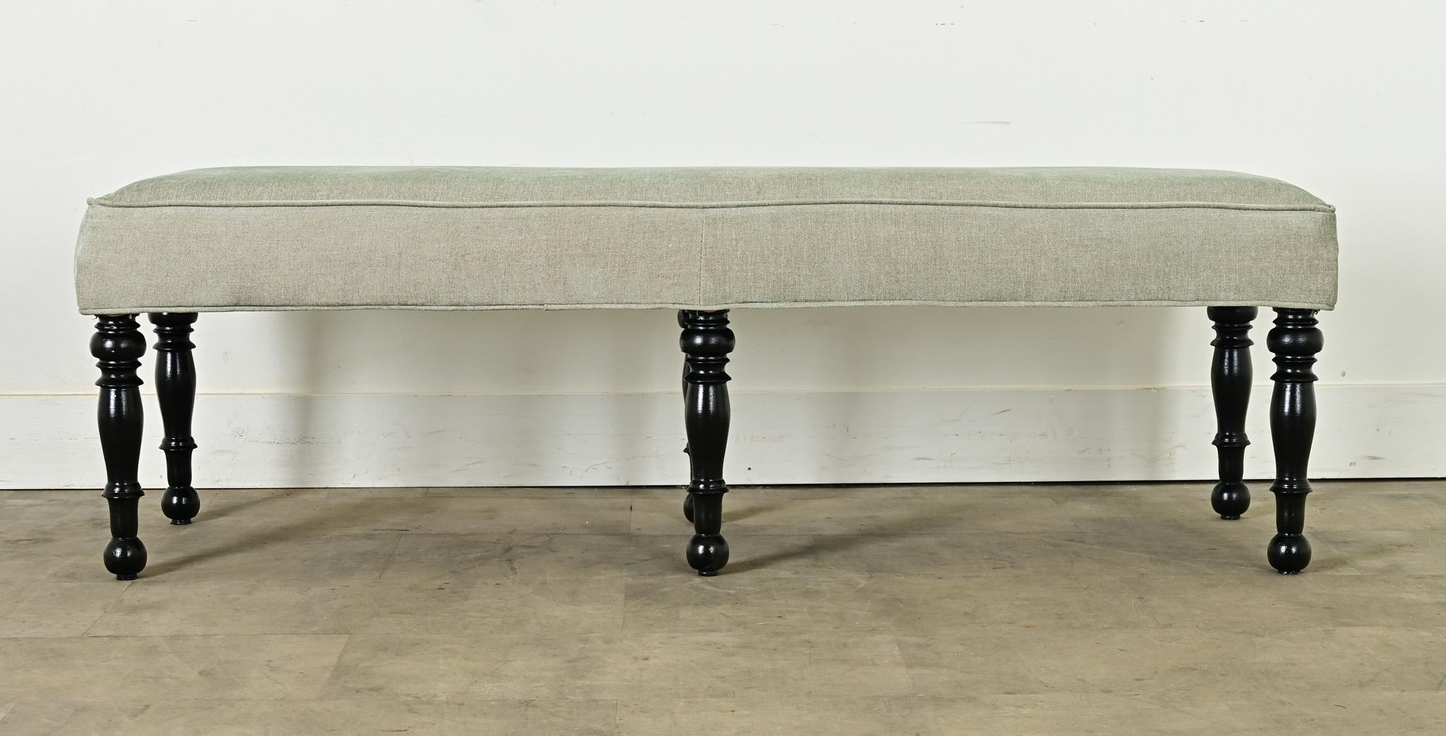 Fabulous six-leg bench from France, vintage 20th century, that fits with English Regency to Louis XVI, to transitional styles of today. Upholstered in a soft green brushed twill the color of beach glass, the thick and wide bench seat is supported by