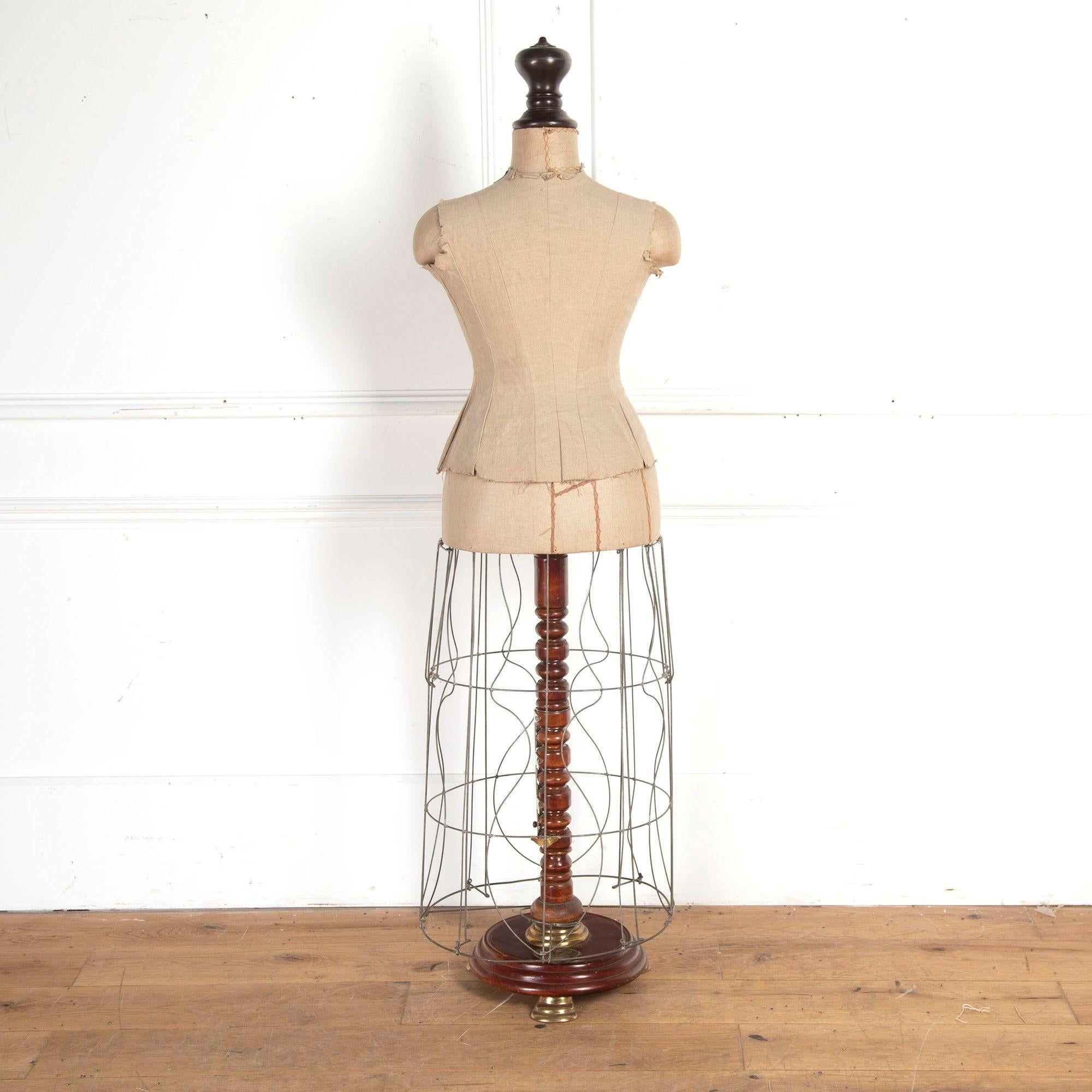 Fabulous French 20th century tailor's mannequin.
With adjustable height and metal skirt. It has a brass stamp on the base and a paper stamp on the skirt stating 