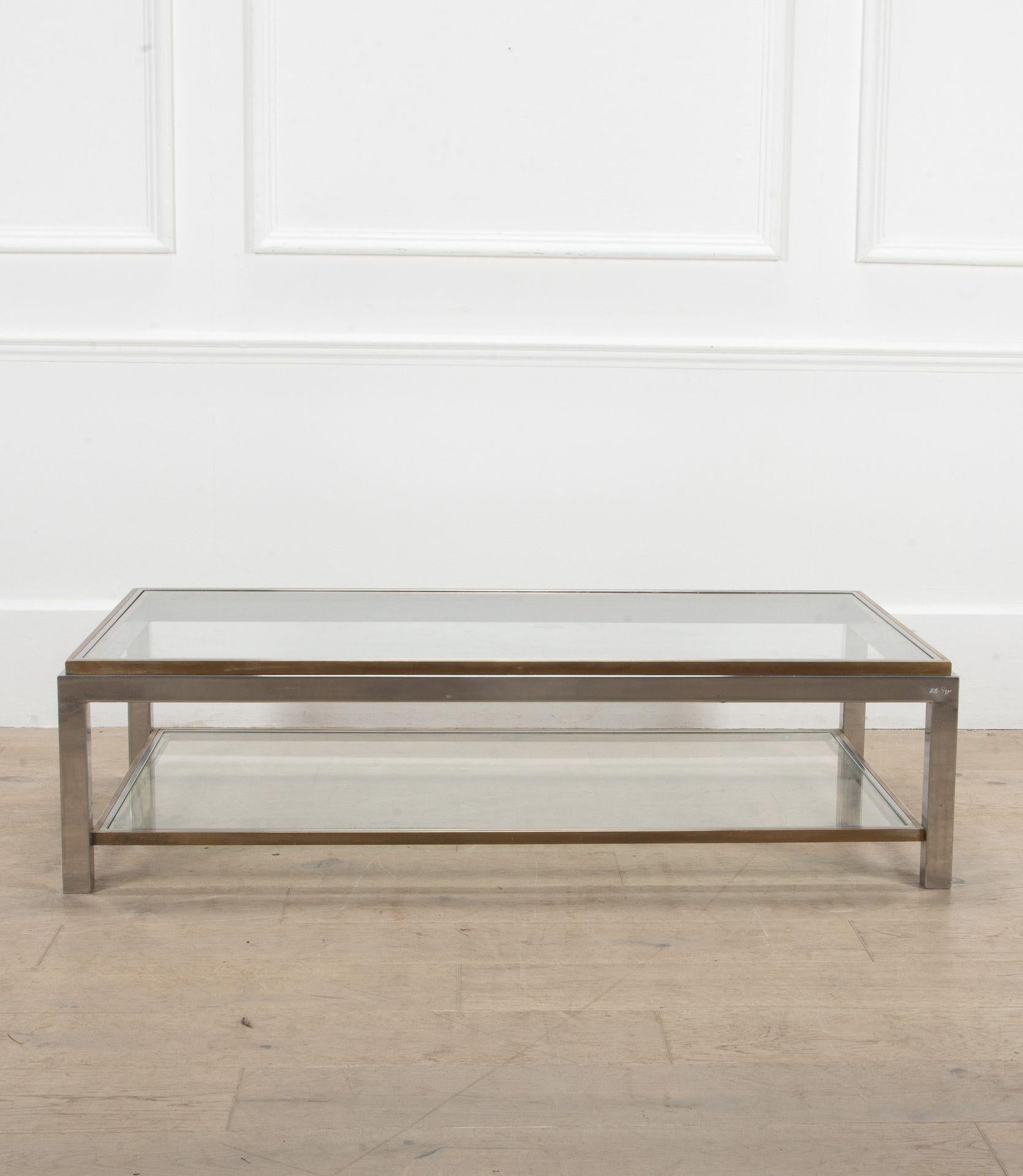 A fantastic French 20th Century chrome and brass two tier large coffee table.
Signed: Willy Rizzo.
Circa 1970.