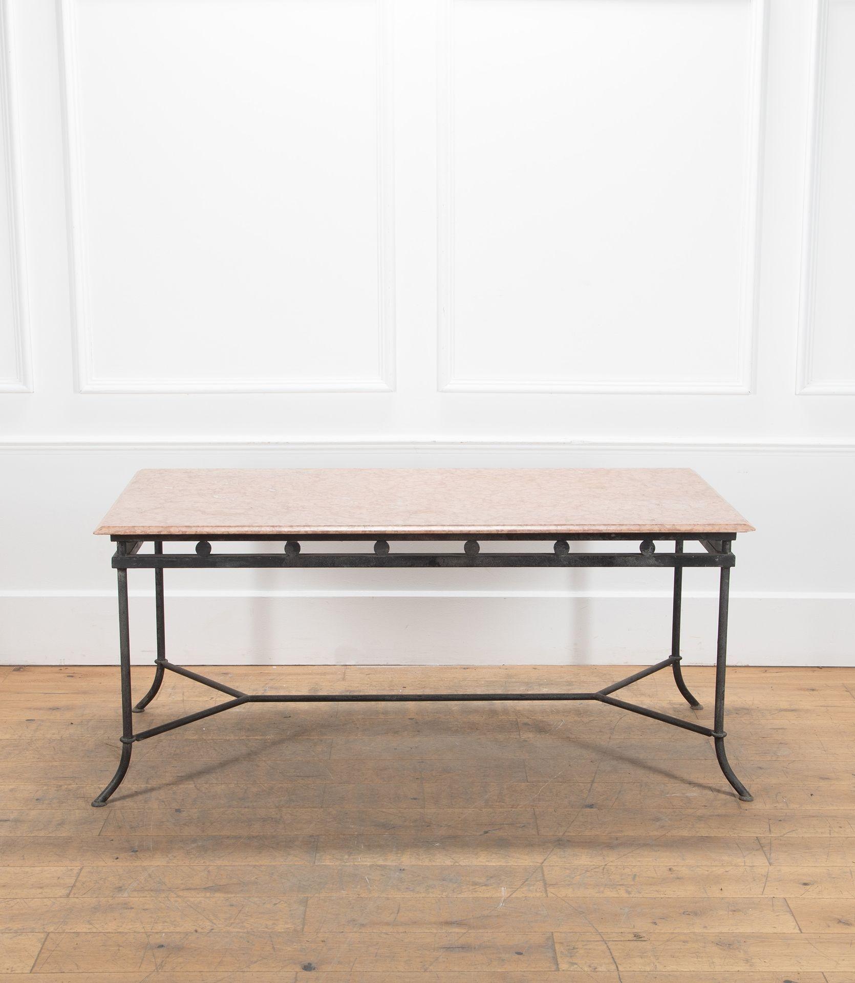 Wrought iron mid century table.
Featuring disc detail and sweeping legs and breccia pernice marble top.
Circa 1960.
