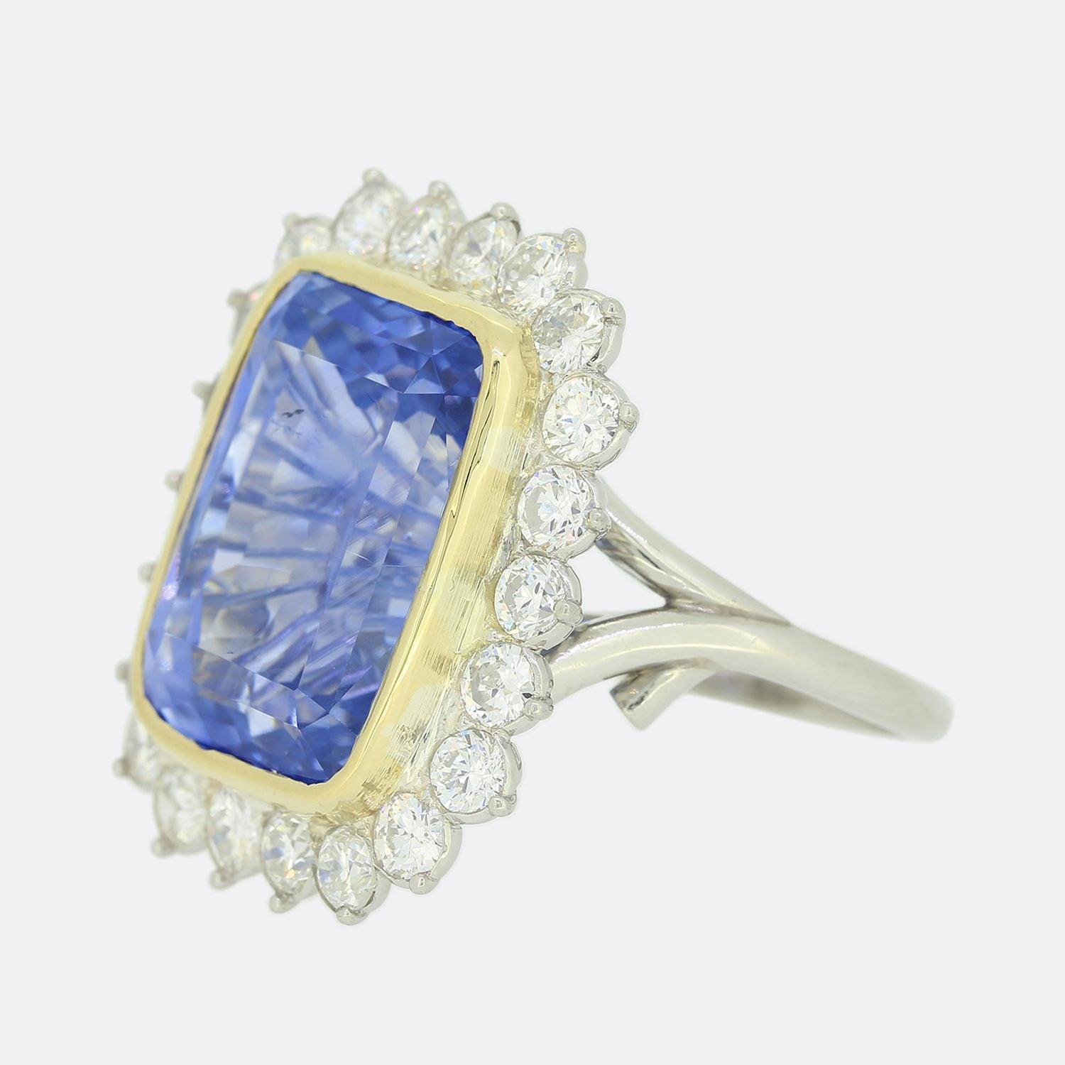 This is a truly wonderful, French sapphire and diamond cluster ring. The cushion cut sapphire is untreated, of ceylon origin and a highly desirable mid blue tone. It is surrounded by 22 bright white round brilliant cut diamonds which sit slightly