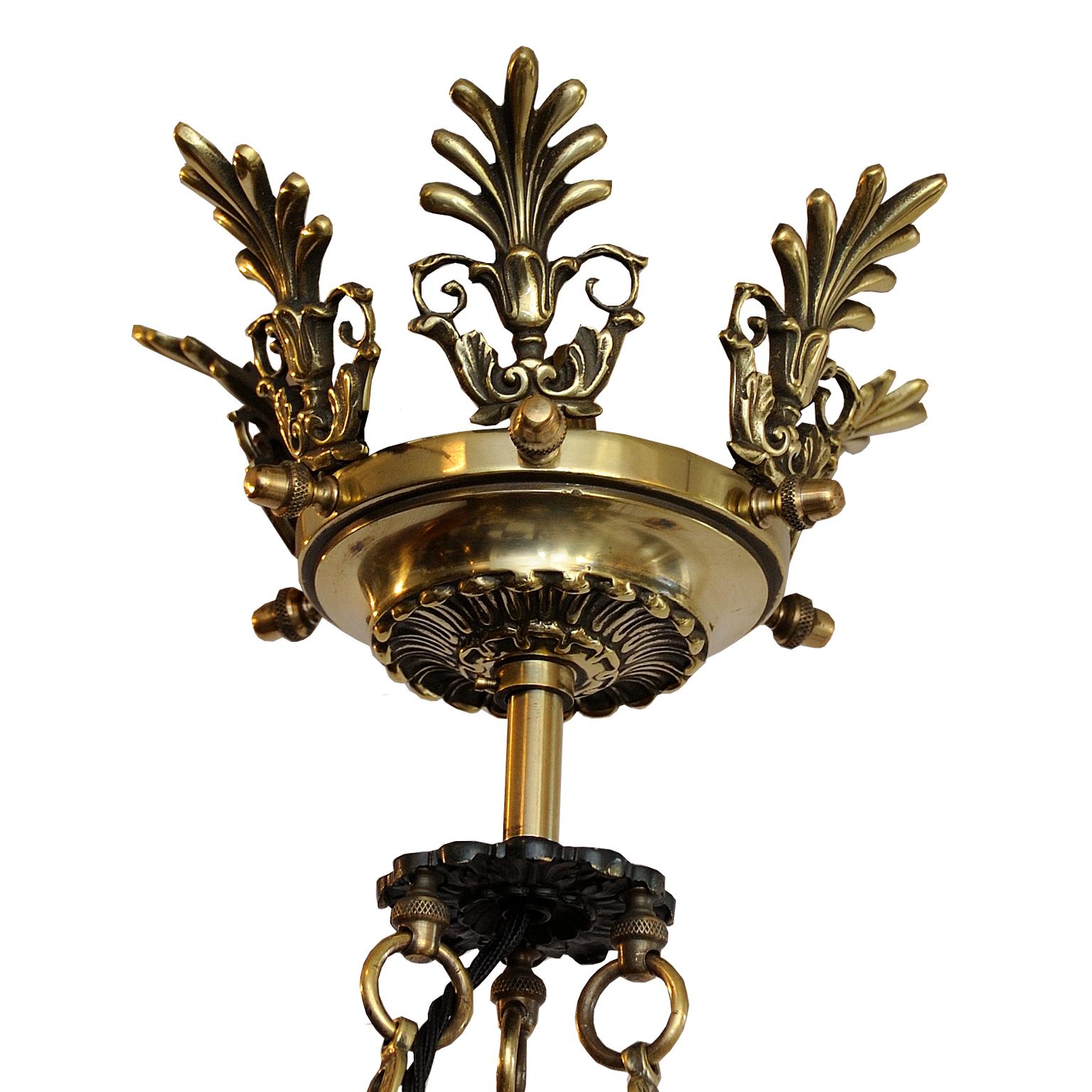 ?This is a very smart French 2nd Empire Napoleonic style tole and brass chandelier, circa 1880.
This lovely piece would be the perfect finishing touch for a room.