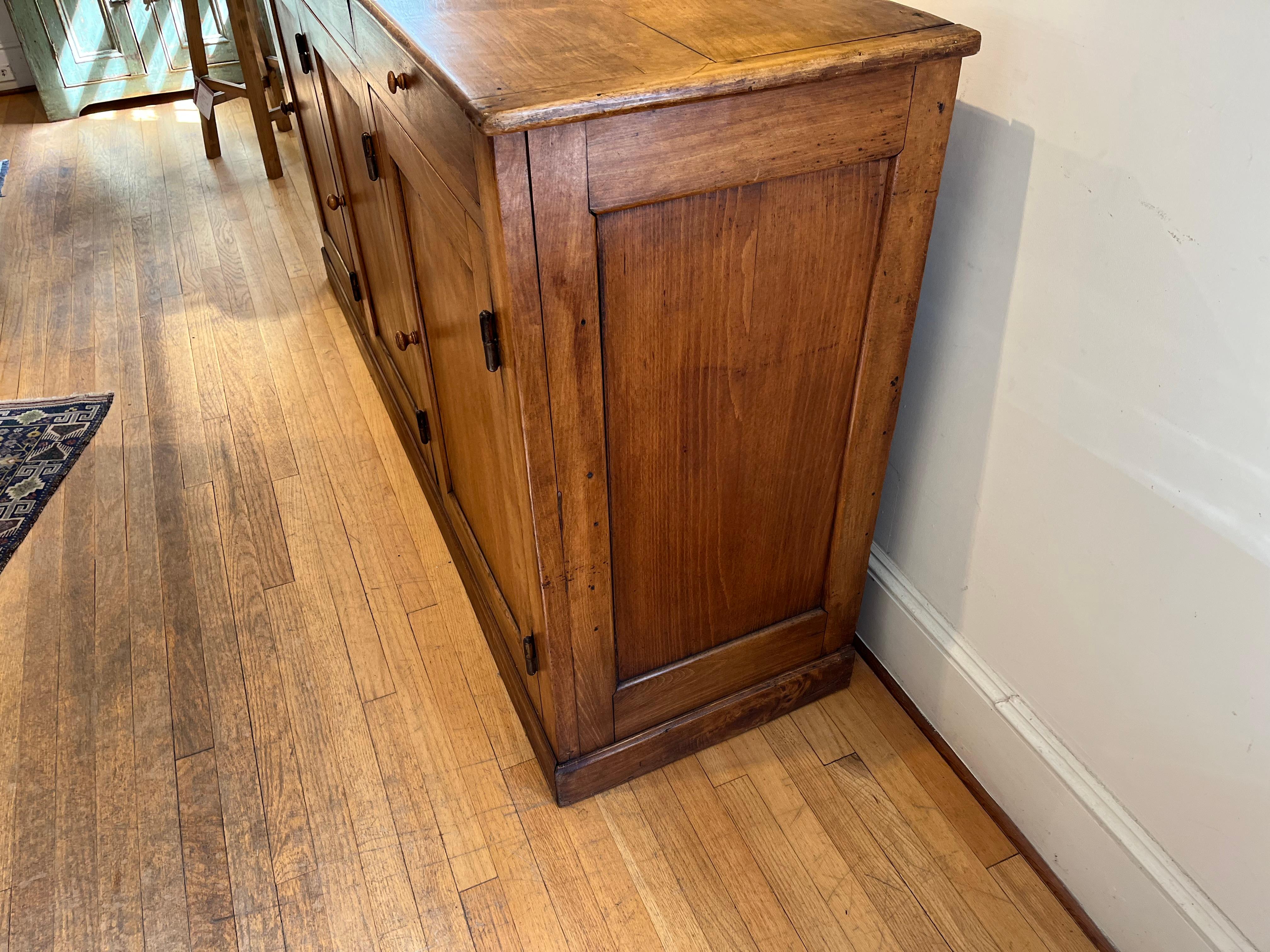 Circa 1840 - the patina will get your attention right away. It has 3 doors and 3 drawers with original hardware. there is plenty of storage room. The color stain is simply soft and wonderful.