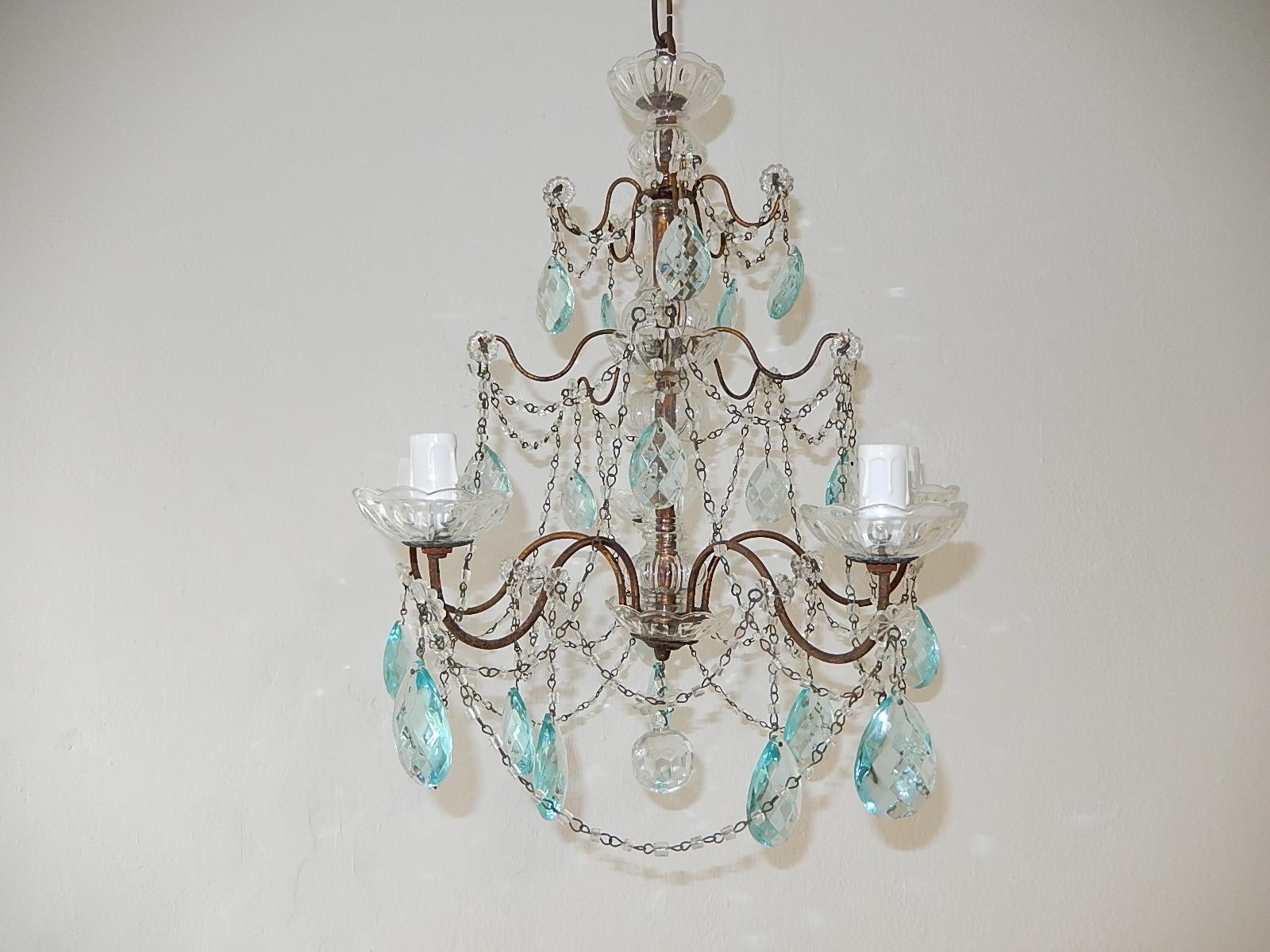 *Rewired and ready to hang! We use certified US UL sockets for the USA as well.  Housing five-light, bobéches in crystal. Swags of small macaroni beads, florets and rare blue Prisms throughout. Murano glass center with crystal bobéches on top and