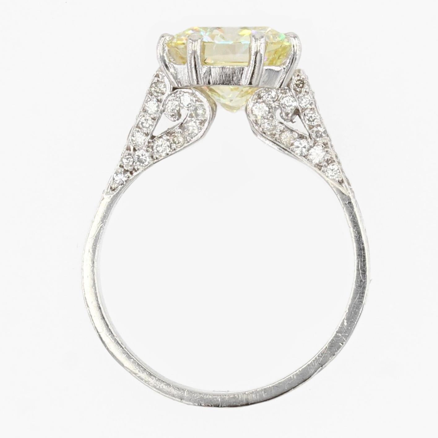 French 3.65 Carat Fancy Yellow Emerald Cut Diamond Platinum Ring For Sale 4
