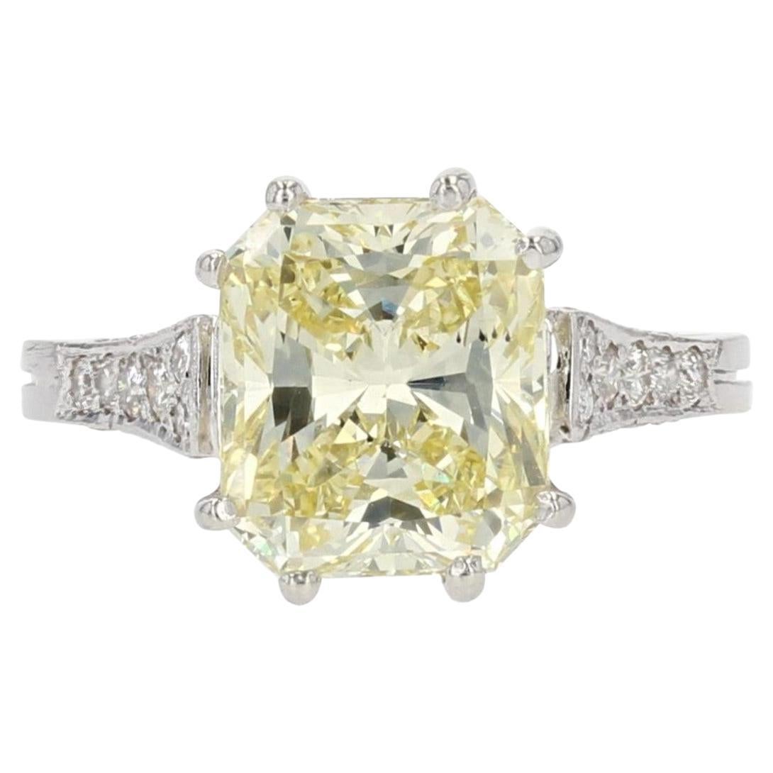 French 3.65 Carat Fancy Yellow Emerald Cut Diamond Platinum Ring For Sale