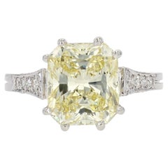 French 3.65 Carat Fancy Yellow Emerald Cut Diamond Platinum Ring