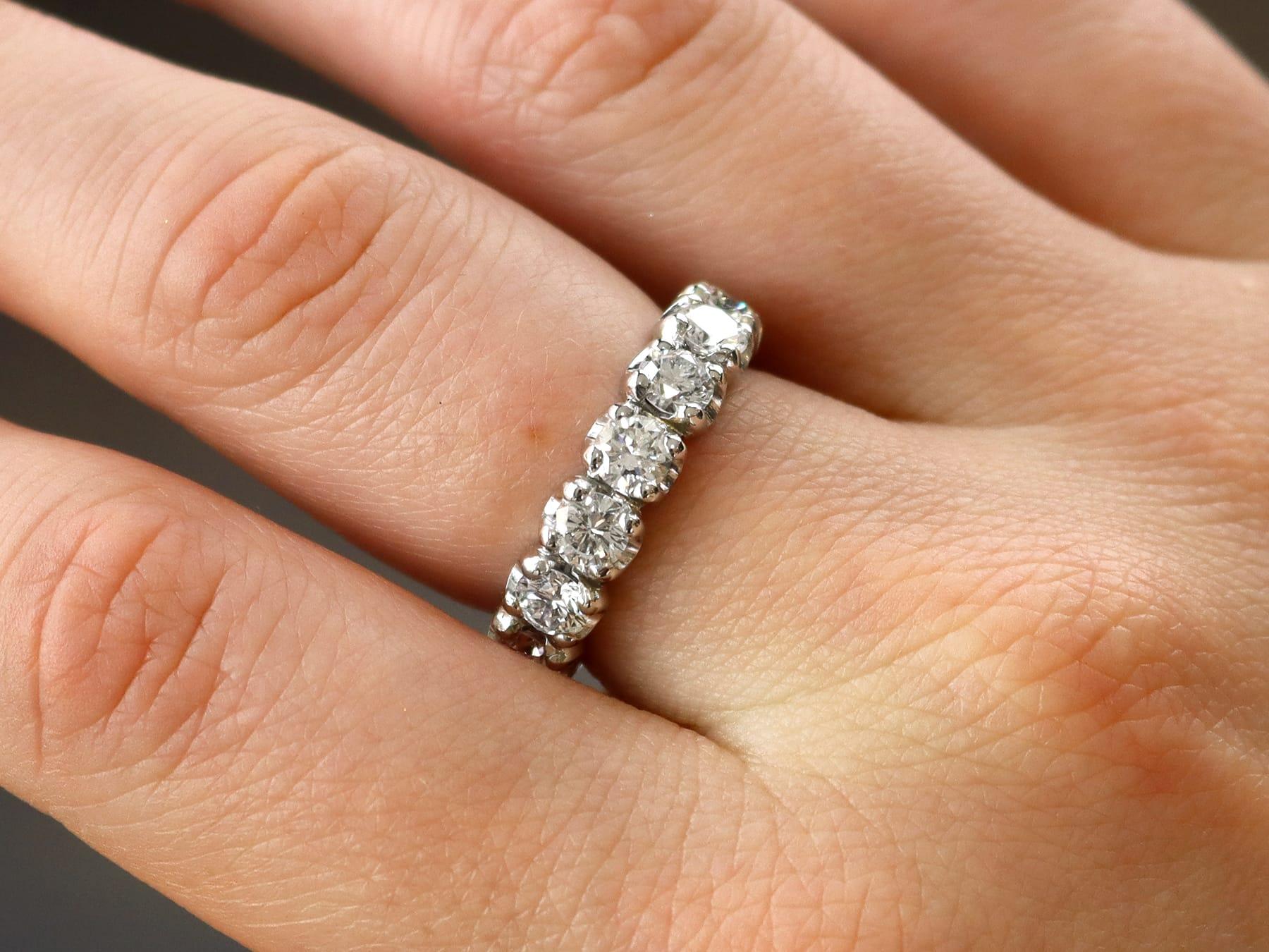 A stunning, fine and impressive vintage French 4.10 carat diamond and 18 karat white gold full eternity ring; part of our diverse diamond jewelry and estate jewelry collections. 

This stunning, fine and impressive full eternity ring has been