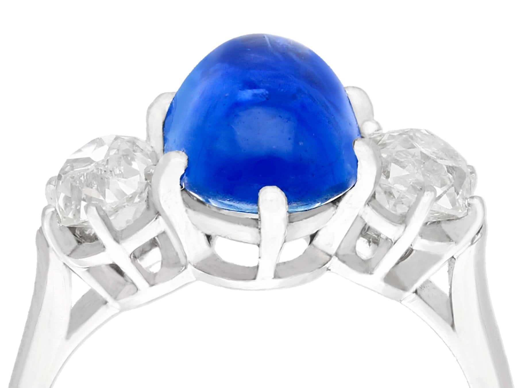 A stunning antique 4.90 carat Burmese sapphire and 1.39 carat diamond, platinum cocktail ring; part of our diverse antique jewelry and estate jewelry collections.

This stunning, fine and impressive antique cabochon cut sapphire ring has been