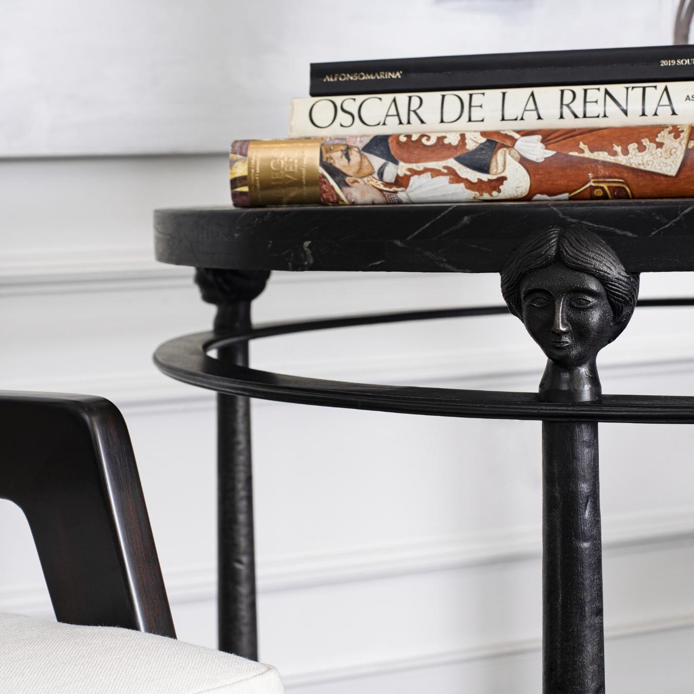 Inspired by the French 50´s, a lamp table with 4 legs metal base with Caryatids and a downward cone shape, has a rustic marble top achieving a casual but elegant look which allows this table to go in all kinds of decoration.
    