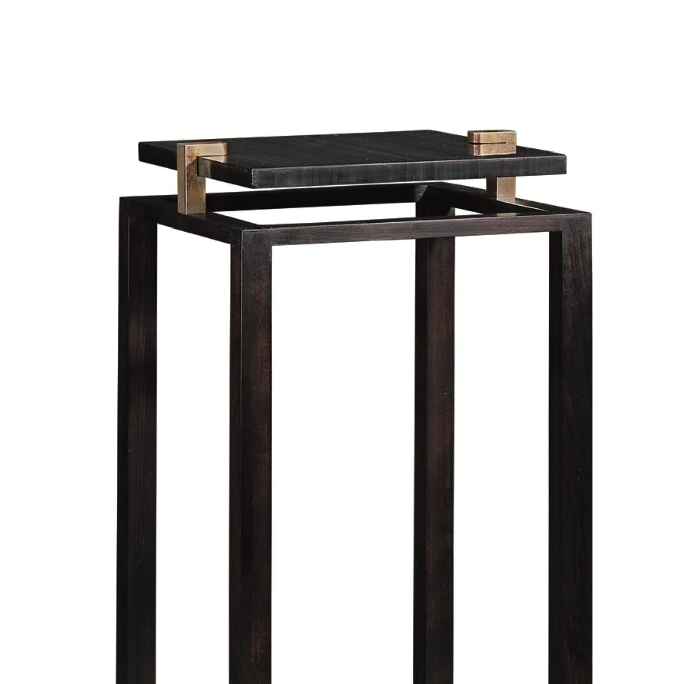 This contemporary stand was inspired by the French 50’s and has an ebonized finish, brass and marble top.
 
