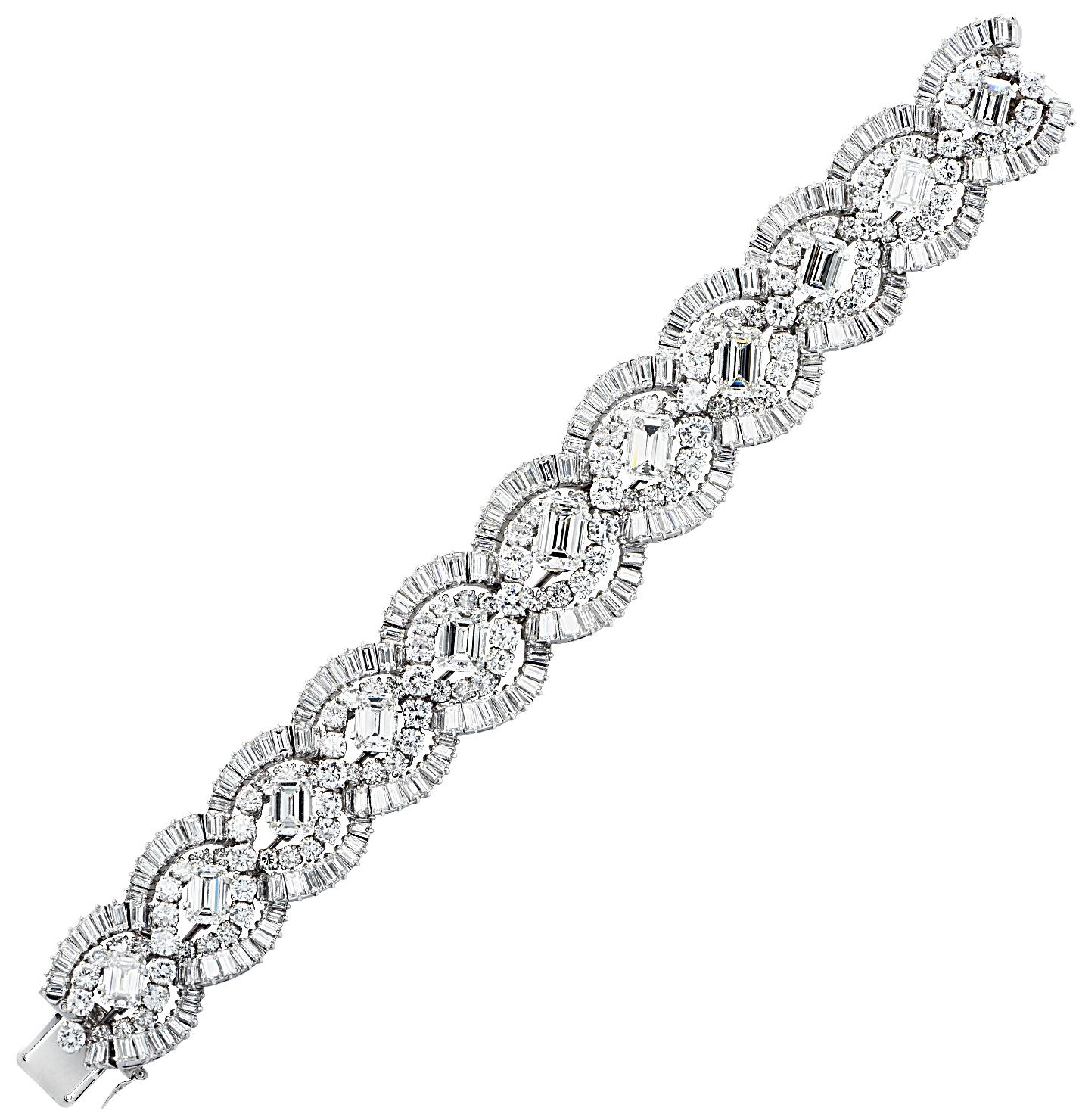 Sensational French diamond bracelet circa 1960, crafted in platinum, showcasing 58.66 carats of round brilliant cut, baguette cut and emerald cut diamonds weighing approximately 58.66 carats total, G-J color, VVS1-SI1 carats. Round brilliant cut and