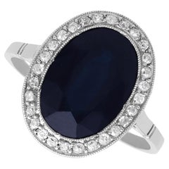 French 6.20 Carat Sapphire 0.43 Carat Diamond Platinum Cluster Ring Circa 1920