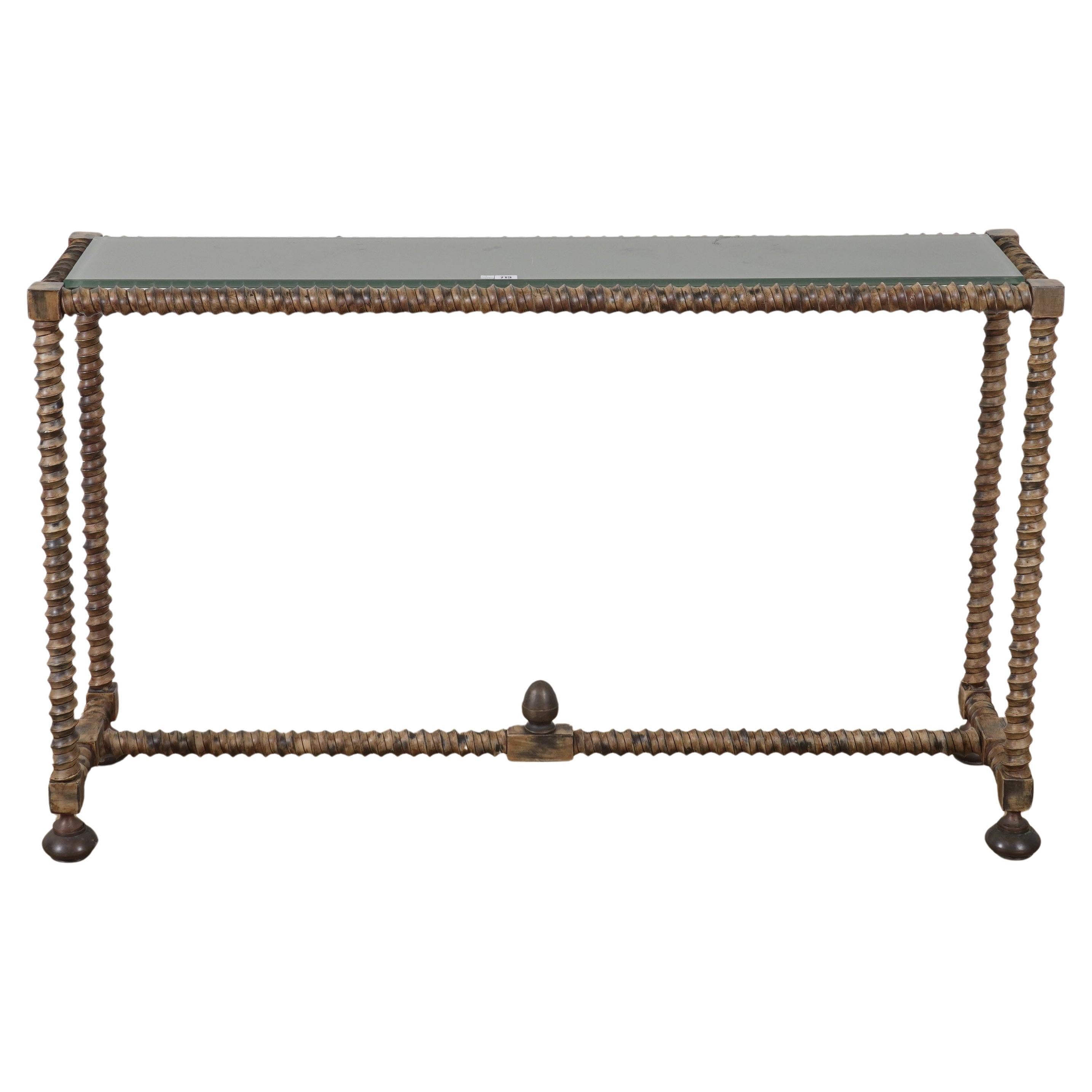 This superb quality twisted and stained  iron console table have thick greyish glass top on rounded iron feet have twisted bar on the bottom. French c.1970's 