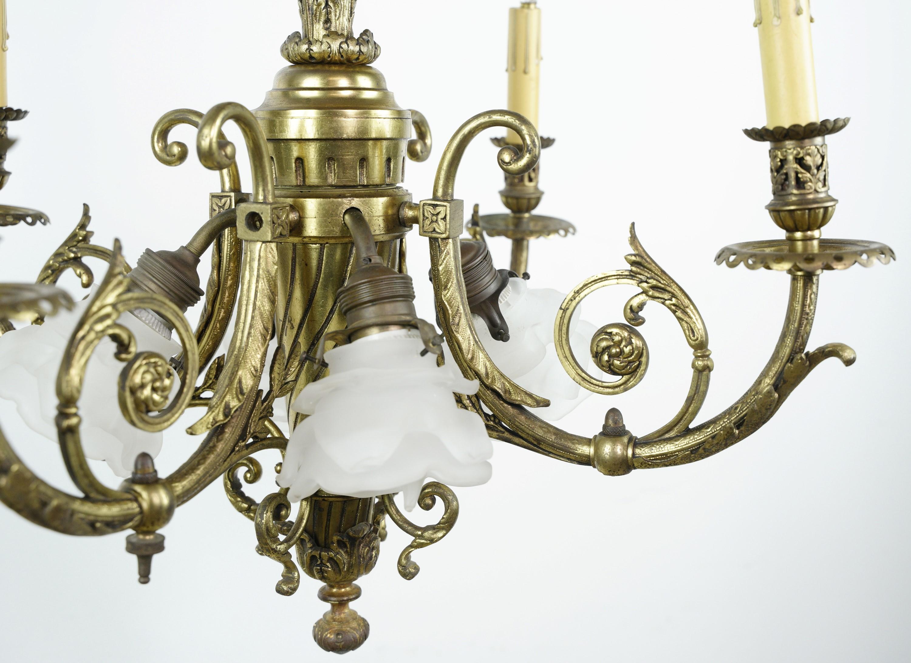 19th Century cast brass floral design chandelier featuring four candlestick arms and four down lights with frosted floral glass shades. Cleaned and restored. This is in good condition, with some wear from age. Please note, this item is located in