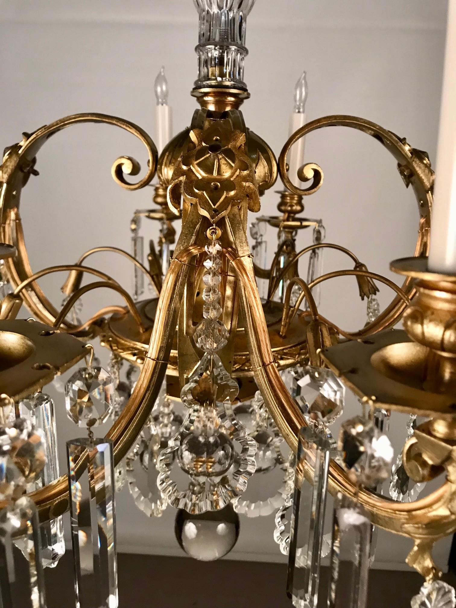 Cast French 8 Light Bronze Chandelier Hung with Crystal Drops For Sale