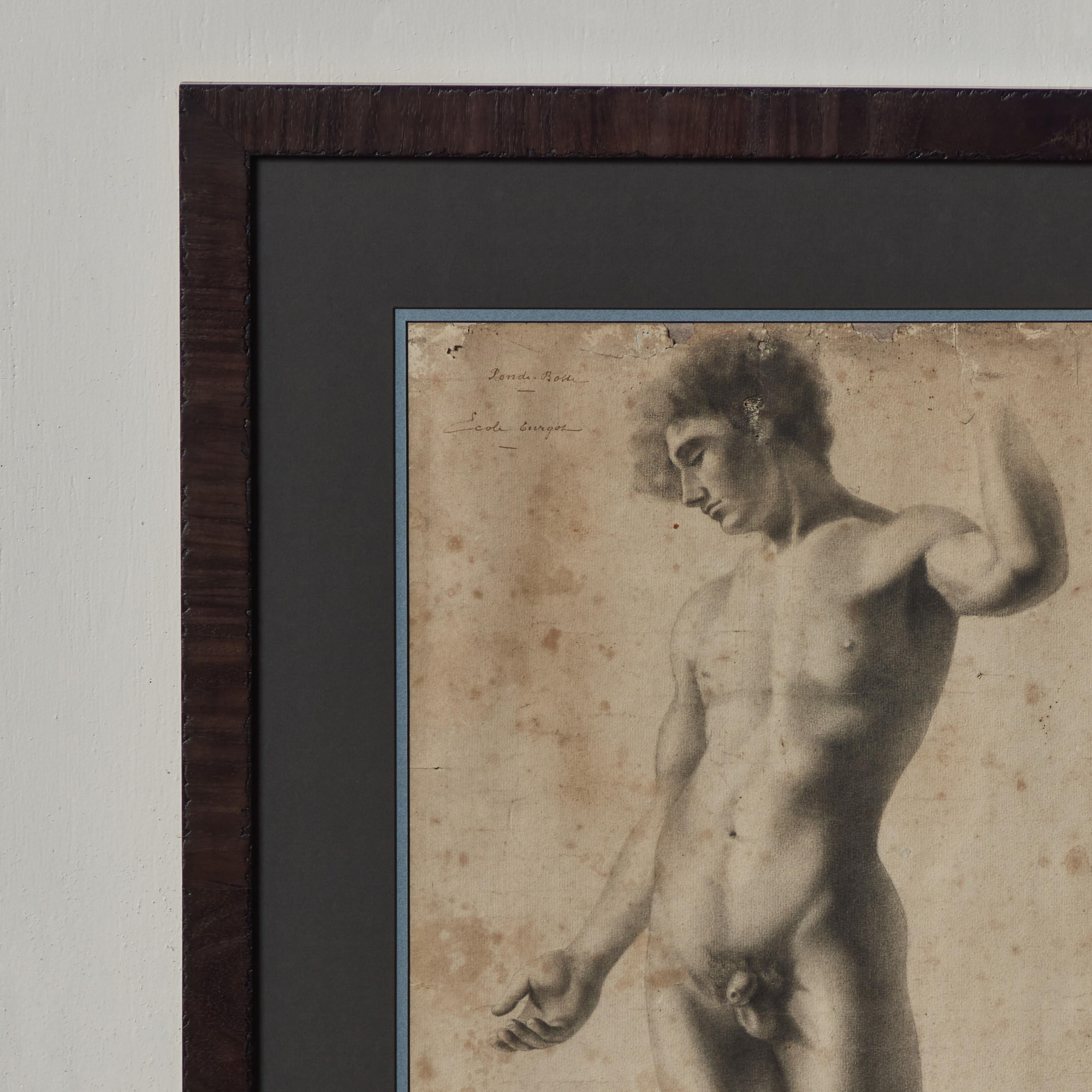 19th Century French academic charcoal drawing of nude male figure standing in the traditional contrapposto pose. With exceptional attention to tonal modeling, the piece has a feeling reminiscent of Caravaggio's early studies. It's unfinished quality