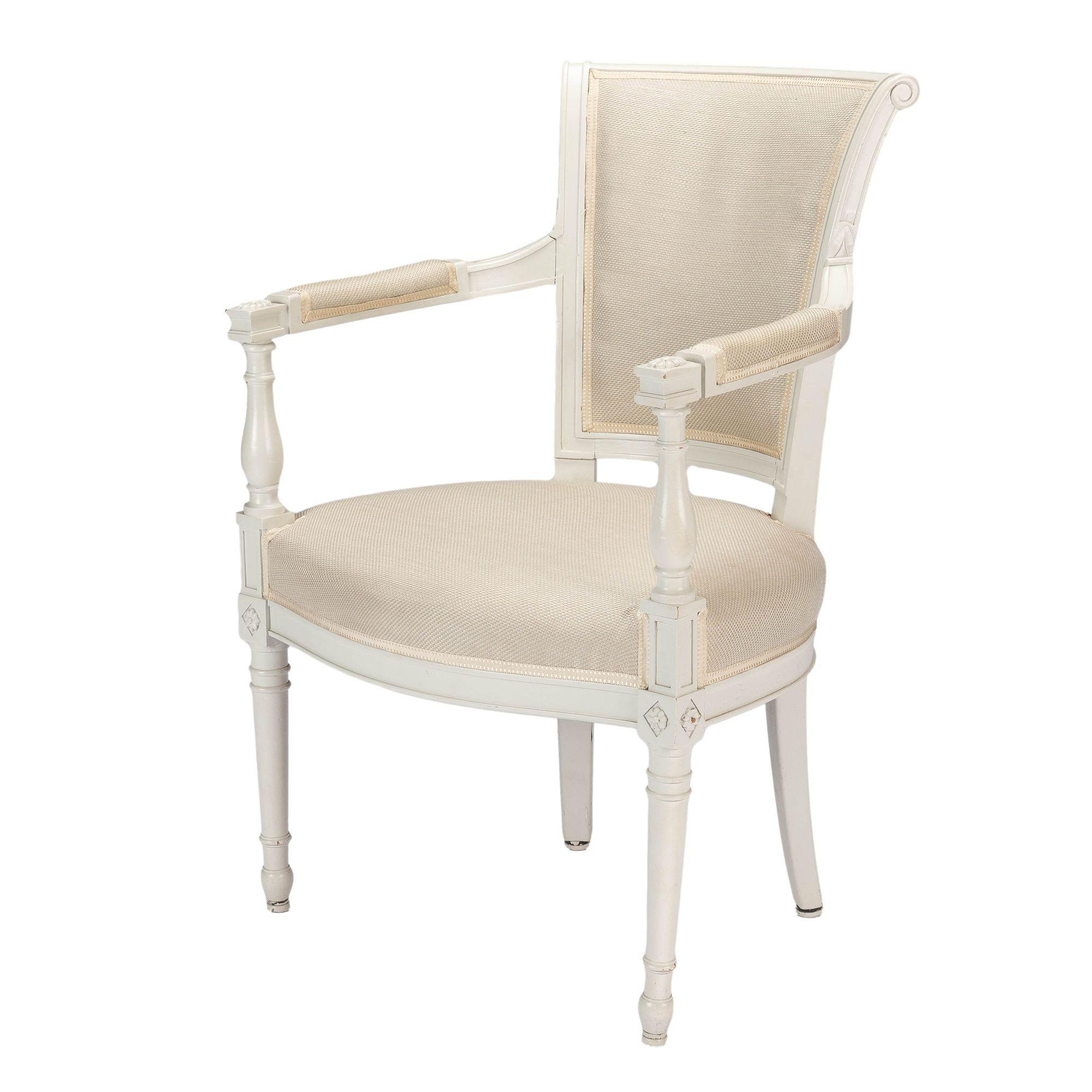 Oyster gray painted beechwood Academic Revival fauteuil in the Louis XVI taste. The chair has a boxed upholstered seat on a painted beechwood seat frame. The front legs are turned and joined at the seat rail to a baluster turned arm post. The arm