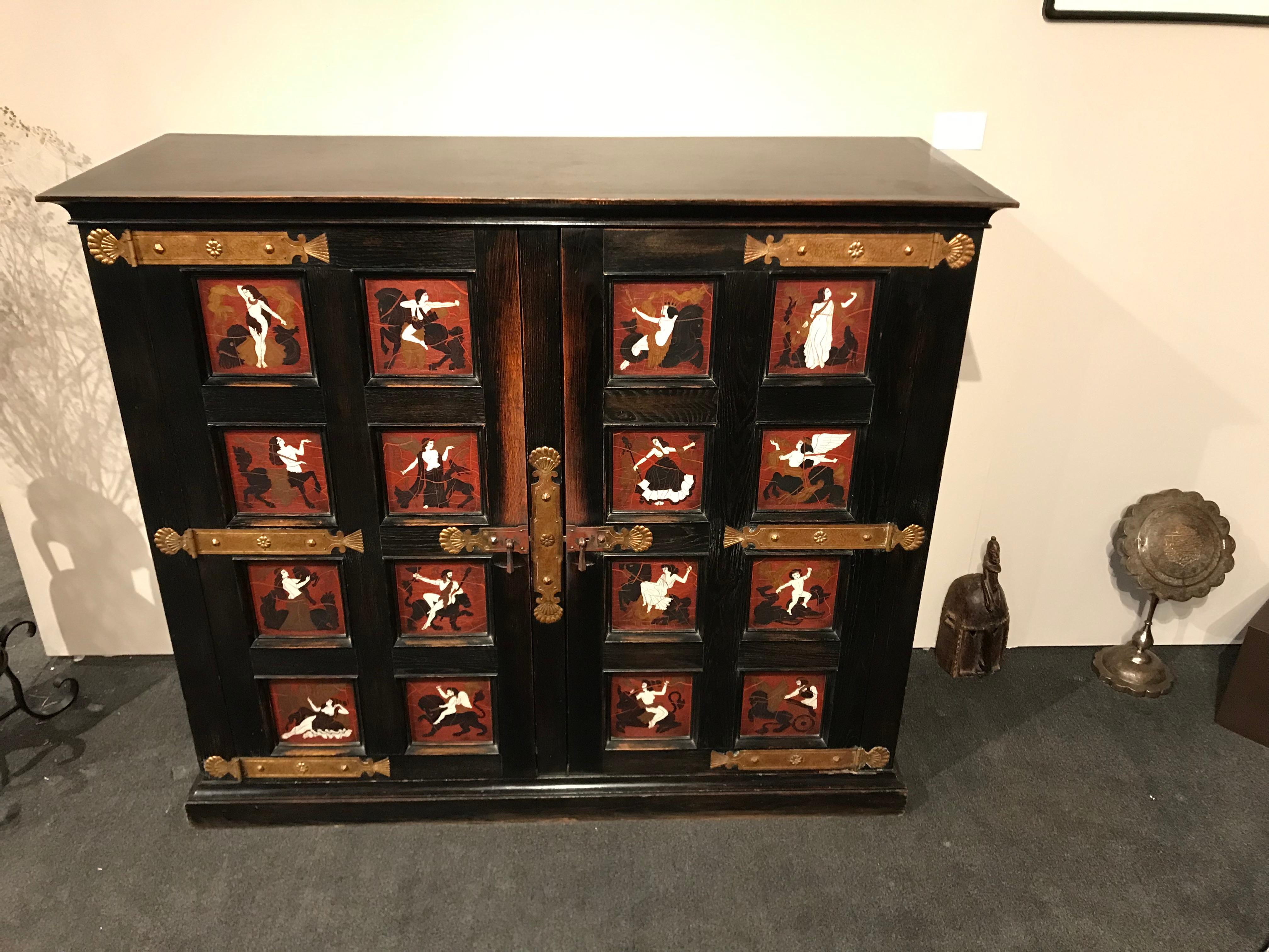 French Aesthetic Movement neoclassical style ebonized oak two-door cabinet depicting painted neoclassical figures. 


   