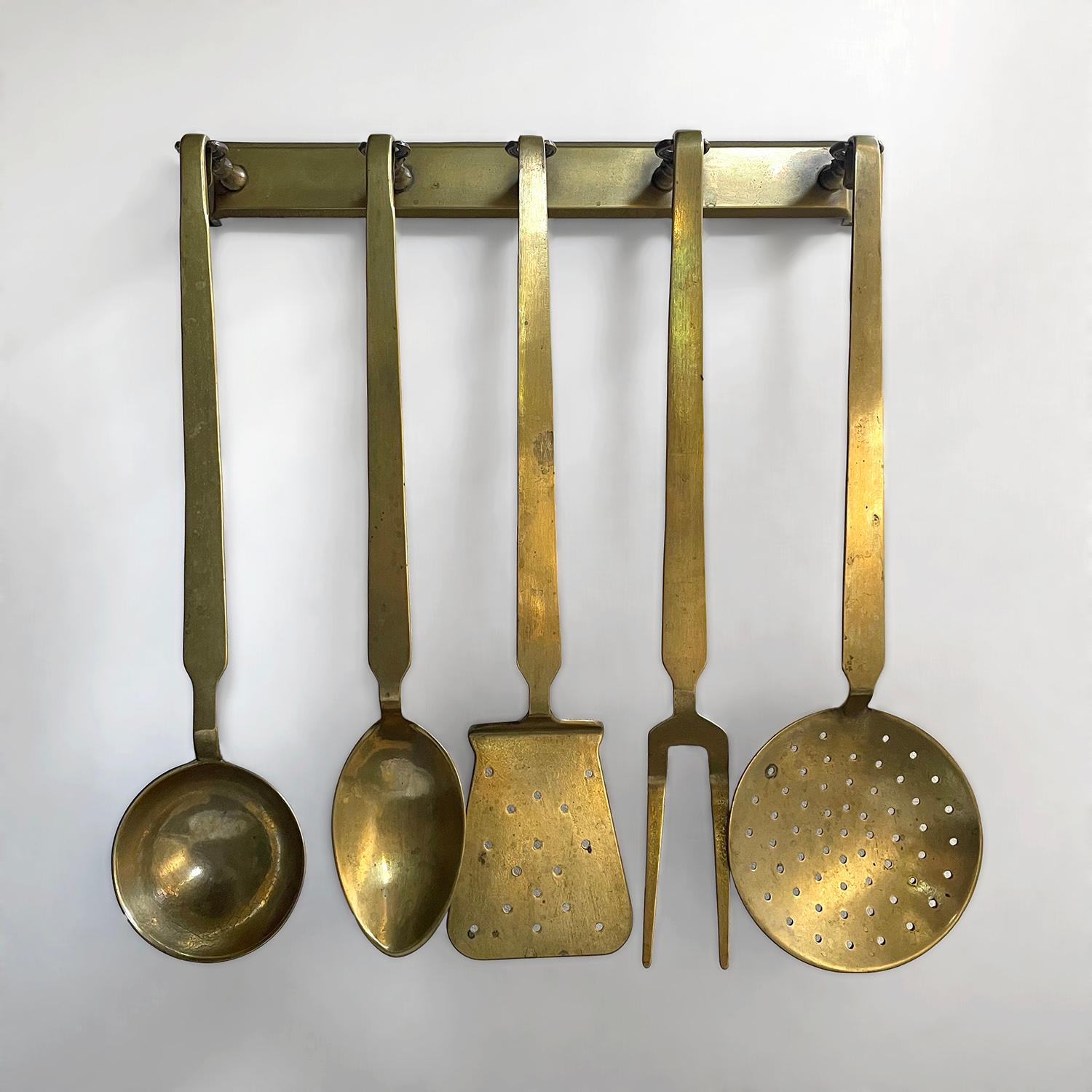 French aged brass cooking set
Lovely addition to any French style kitchen 
This rare find will last the test of time
Five piece aged brass cooking set includes 
Spatula, slotted spoon, spoon, ladle and fork
Each piece is suspended from an individual
