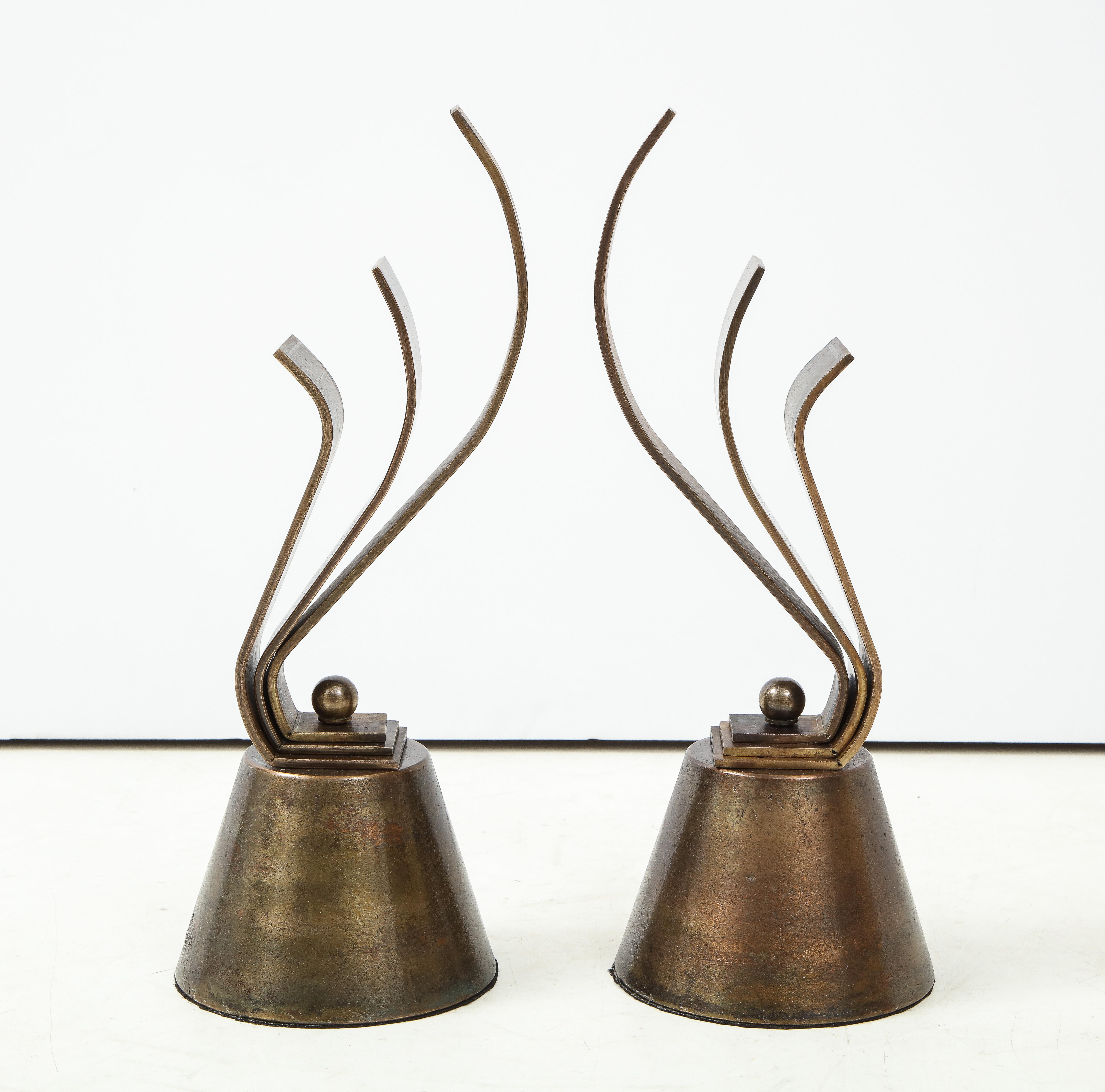 Pair of French Art Deco decorative aged bronze chenets, circa 1940s.