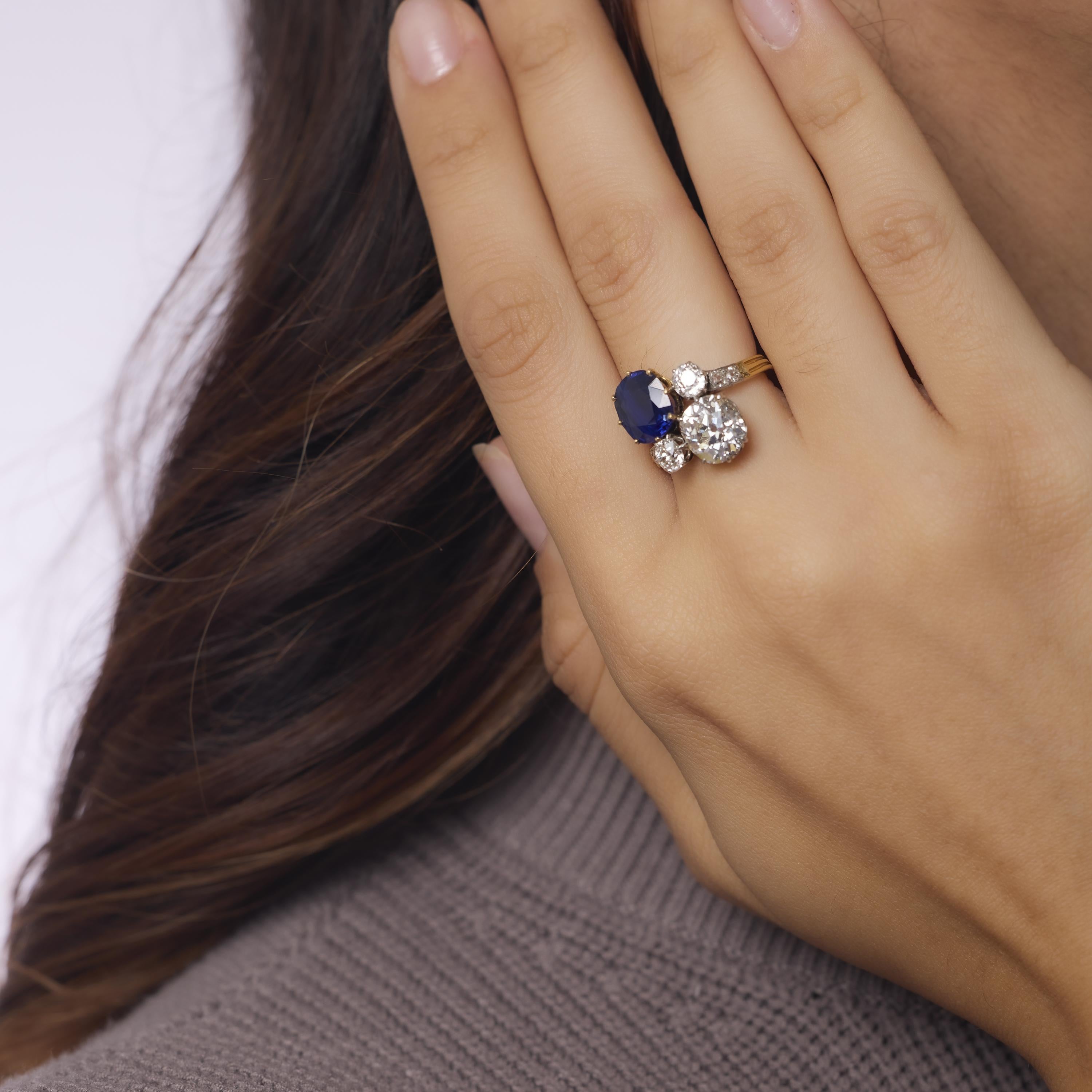 This enchanting Victorian toi et moi ring in 18k yellow gold unites a 3.42 carat no-heat Australian sapphire with a glowing 2.75 carat old mine cut diamond. Certified by AGL, the vivid sapphire and antique diamonds form a romantic pairing, accented