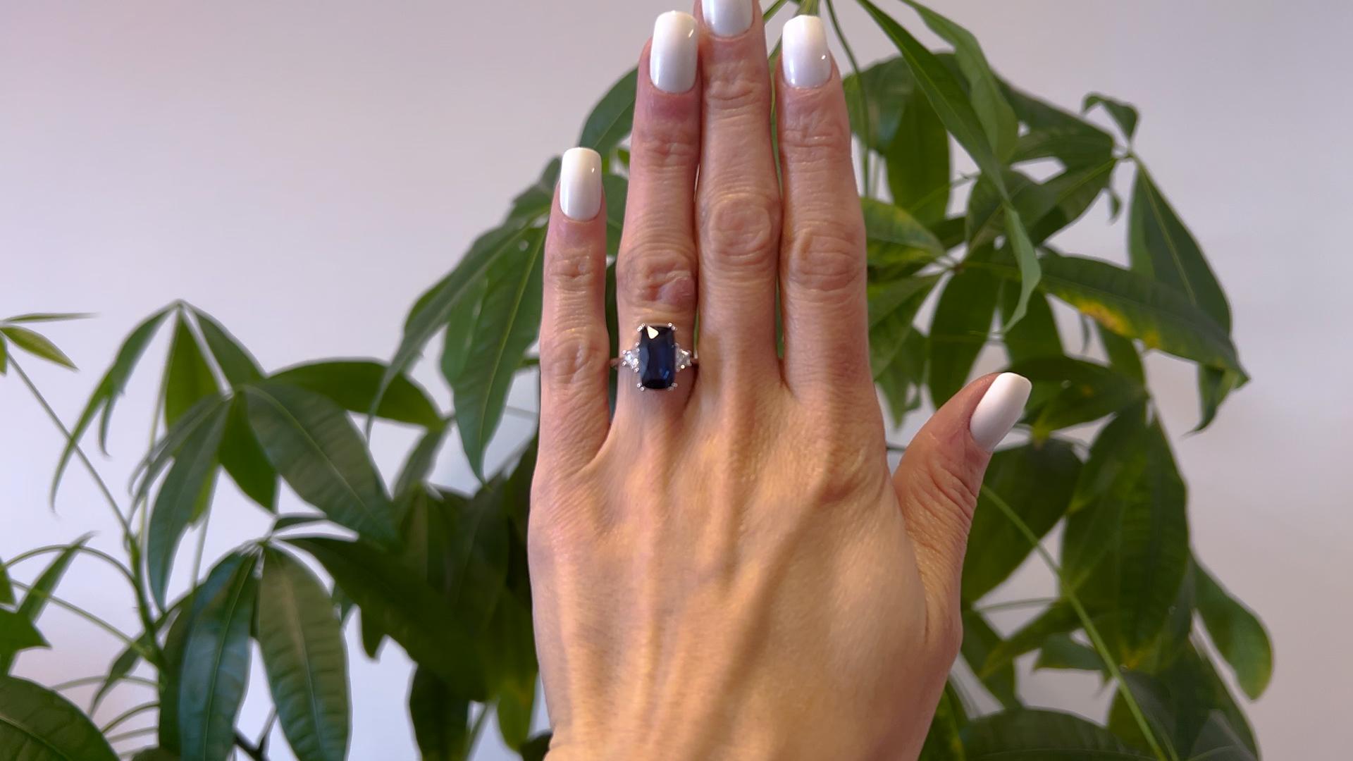 One French AIGS Madagascar No Heat Sapphire and Diamond 18k White Gold Three Stone Ring. Featuring one AIGS cushion cut sapphire of 4.28 carats, accompanied with GIA #GF22062414 stating the sapphire is of Madagascar origin and has no indications of