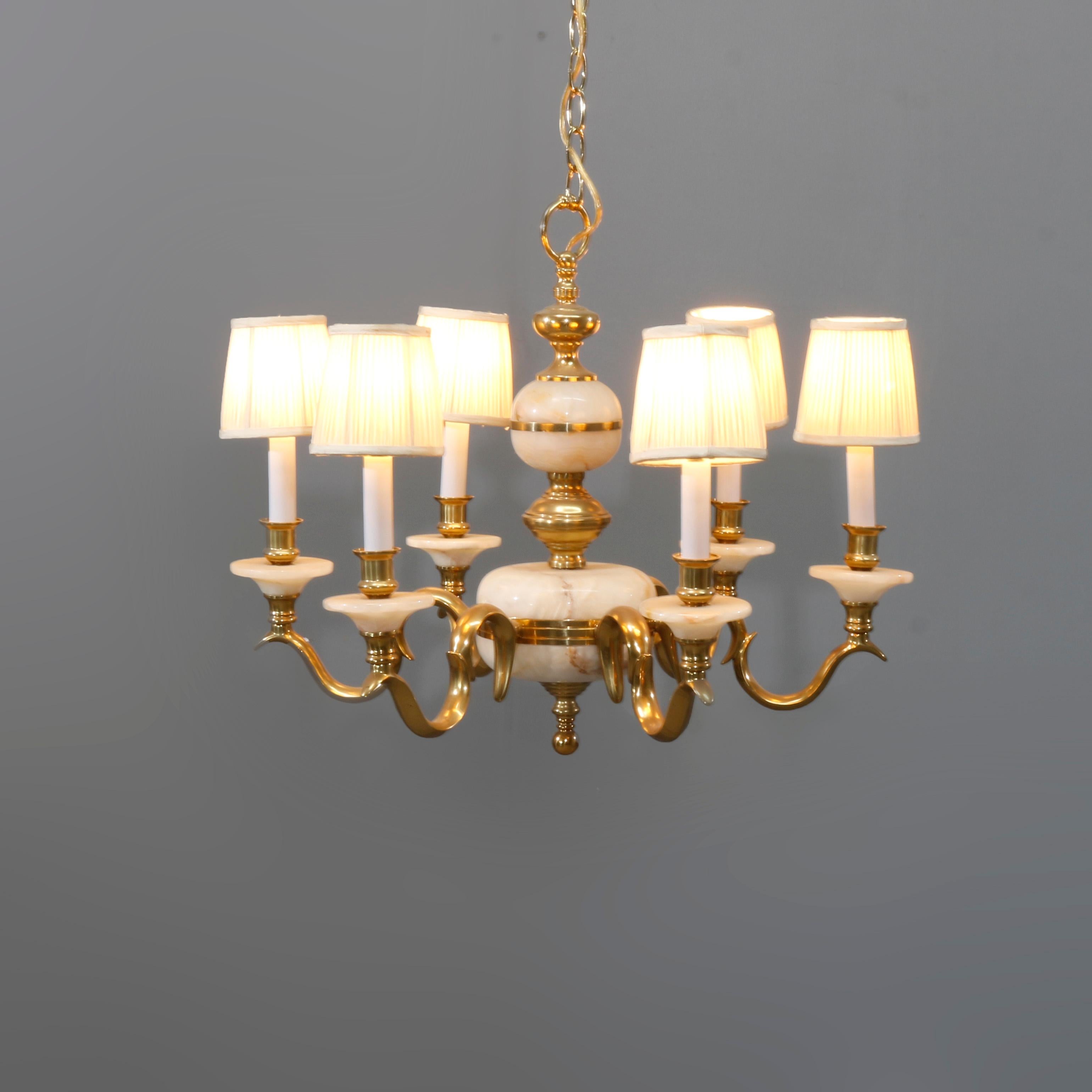 A French chandelier offers brass frame with alabaster column and bobeche elements and scroll form arms terminating in candle lights with shades, 20th Century

Measures: 40.5