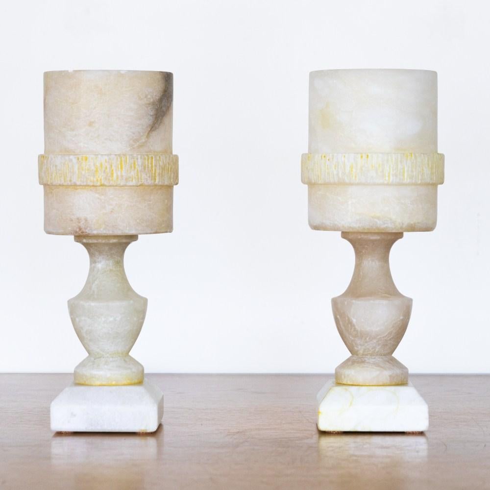 Beautiful alabaster table lamp from France, 1940's. Carved stem and base with an open drum shade with etched detail. Alabaster shows stunning veins and coloring. Vintage piece shows signs of age with some scuffs.  Newly re-wired. Takes one E12 base