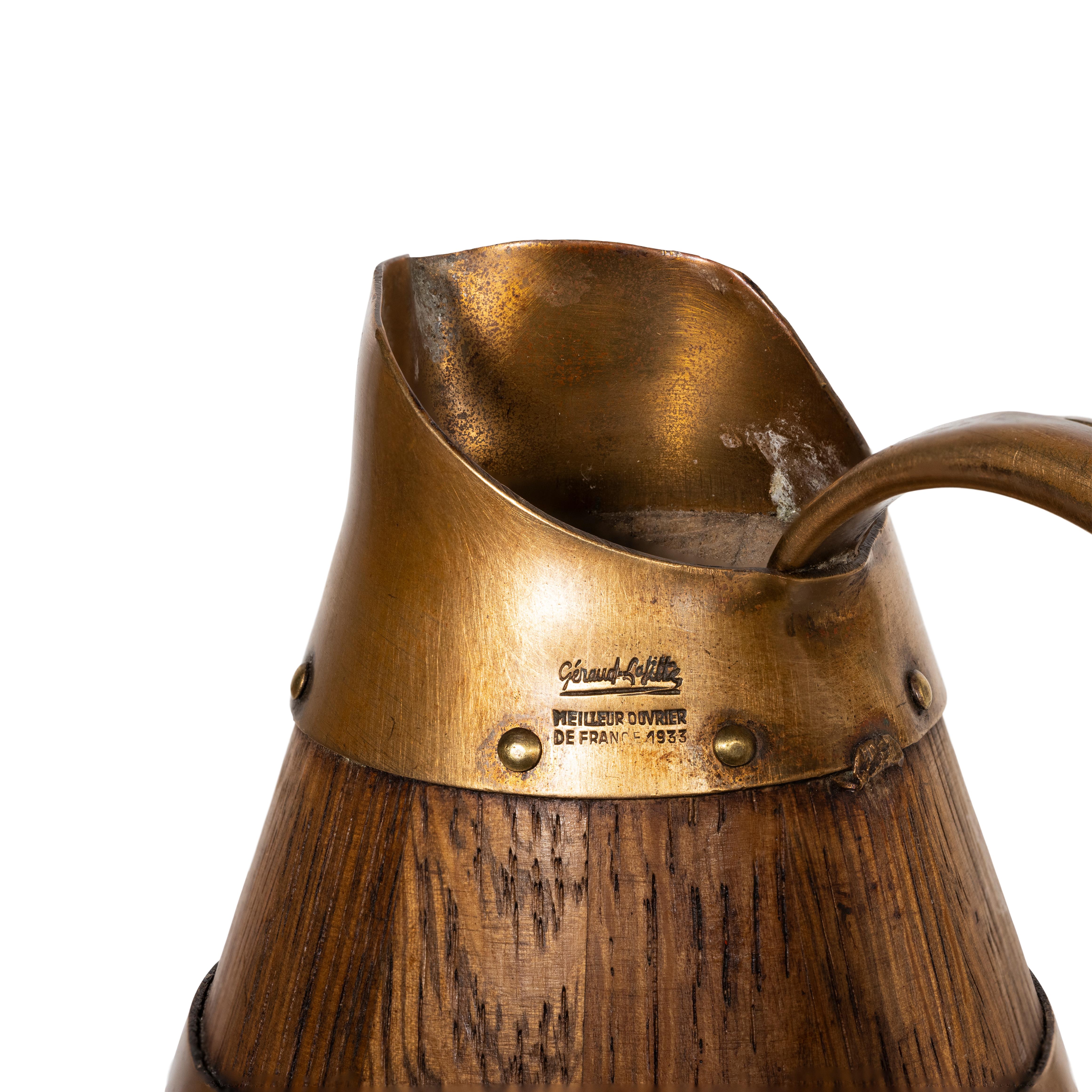 French alascian wine pitcher. Oak with hammered nickel banding. A great barware piece!

Period: Early 20th Century
Origin: France
Size: 8