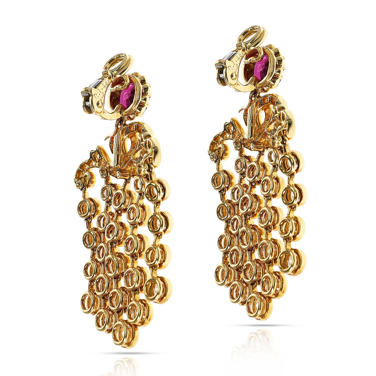 A stunning pair of French Alexandre Reza Ruby and Diamond Cocktail Dangling Earrings made in 18K Gold. The total weight of the rubies are 3.01 carats and the total diamond weight is 8.49 carats. The total weight of the earrings is 23.10 grams. The