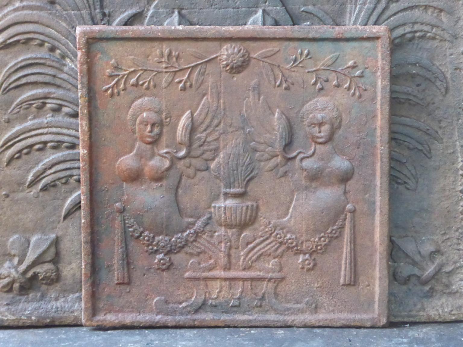 18th-19th century French fireback with an allegory of love. 

The fireback is made of cast iron and has a natural brown patina. Upon request it can be made black / pewter. The fireback is in a good condition and does not have