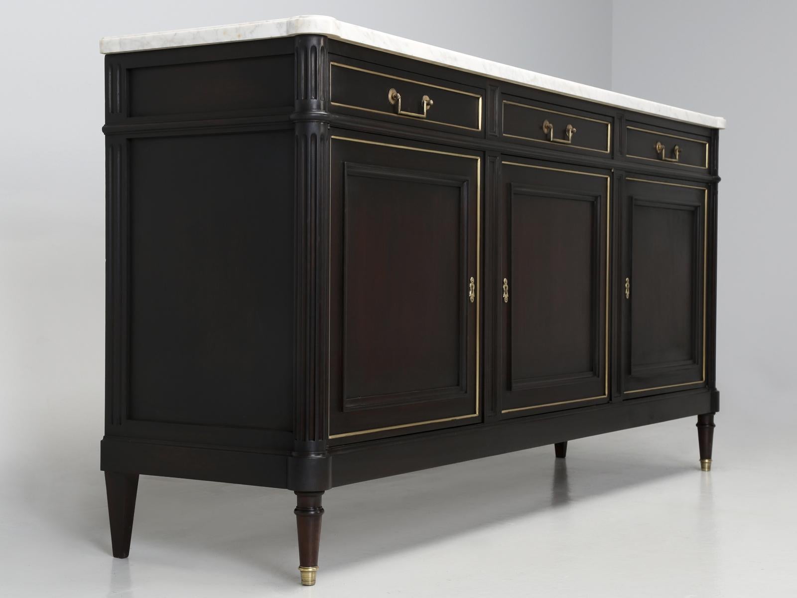 Classic French Louis XVI style buffet, that was just restored, by our inhouse restoration department and although at first blush, it appears to be ebonized, it is actually more of a dark coffee bean color, that blends more harmoniously with the