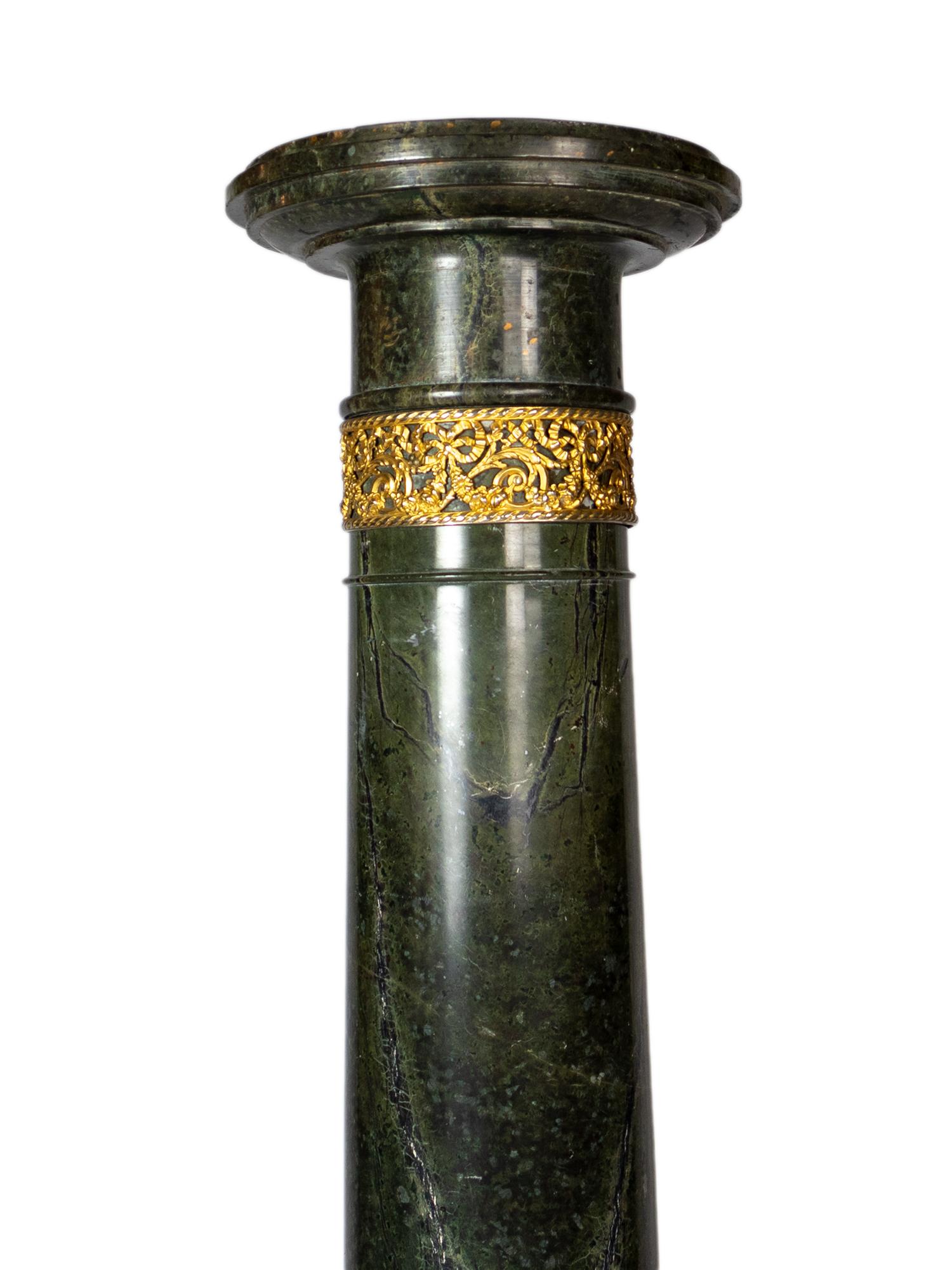 A neoclassical alpine green marble column, gilded bronze.
A late 19th century pedestal for the classic decor.   

