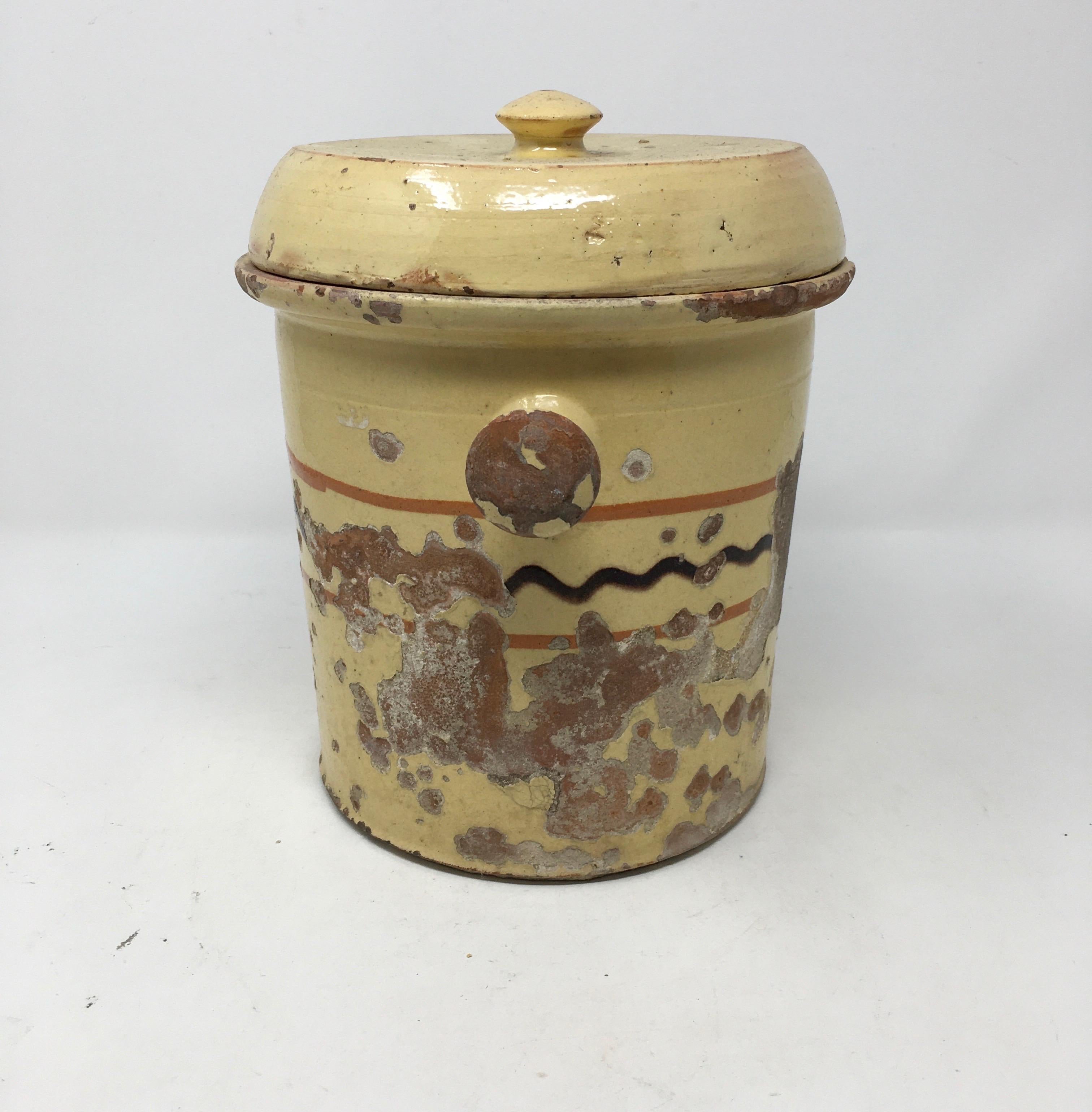 We found this antique Alsatian glazed earthenware preserving/pickling jar in France. These crocks were used to preserve vegetables and retain their nutrients for the winter months. The crock, glazed yellow and painted with a pattern typical of