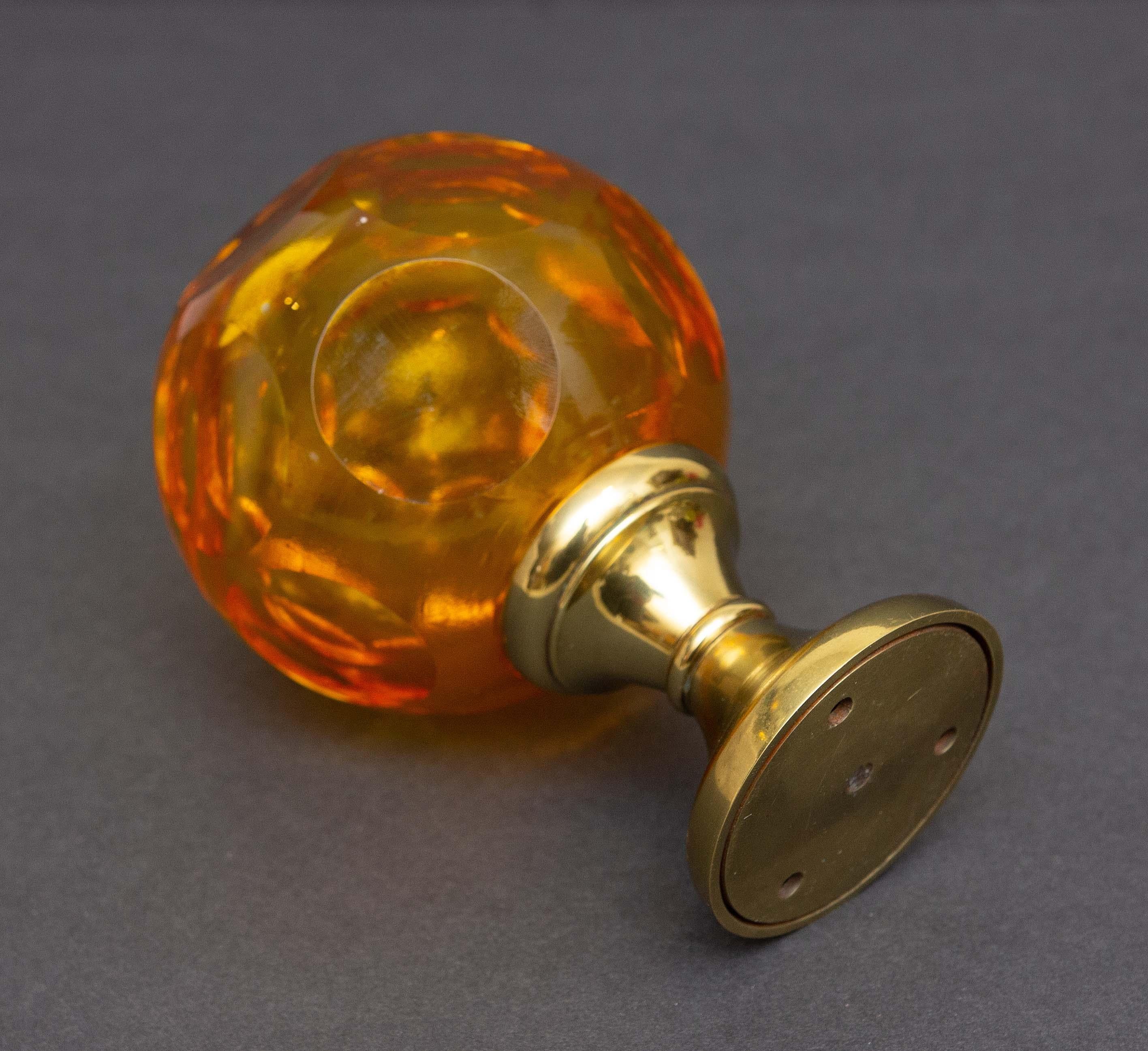 Cut and blown amber glass newel post finial. French. Early 20th century. From an estate collection.