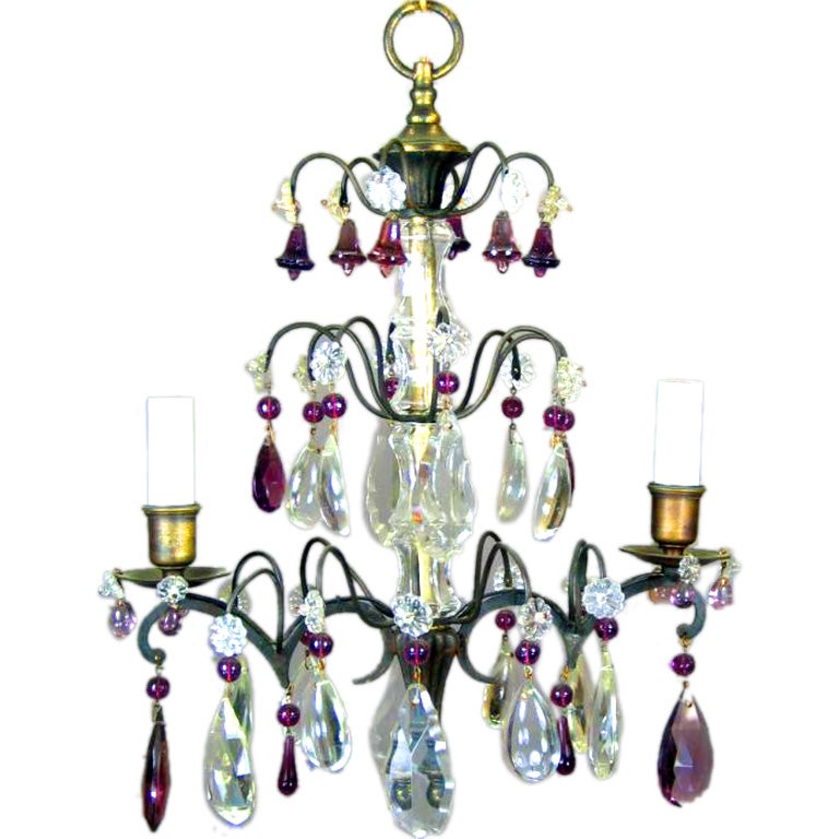 1-4093  A two-light chandelier decorated with amethyst bells and clear crystals.
Takes 2 60 watt candelabra based bulbs.
 
 