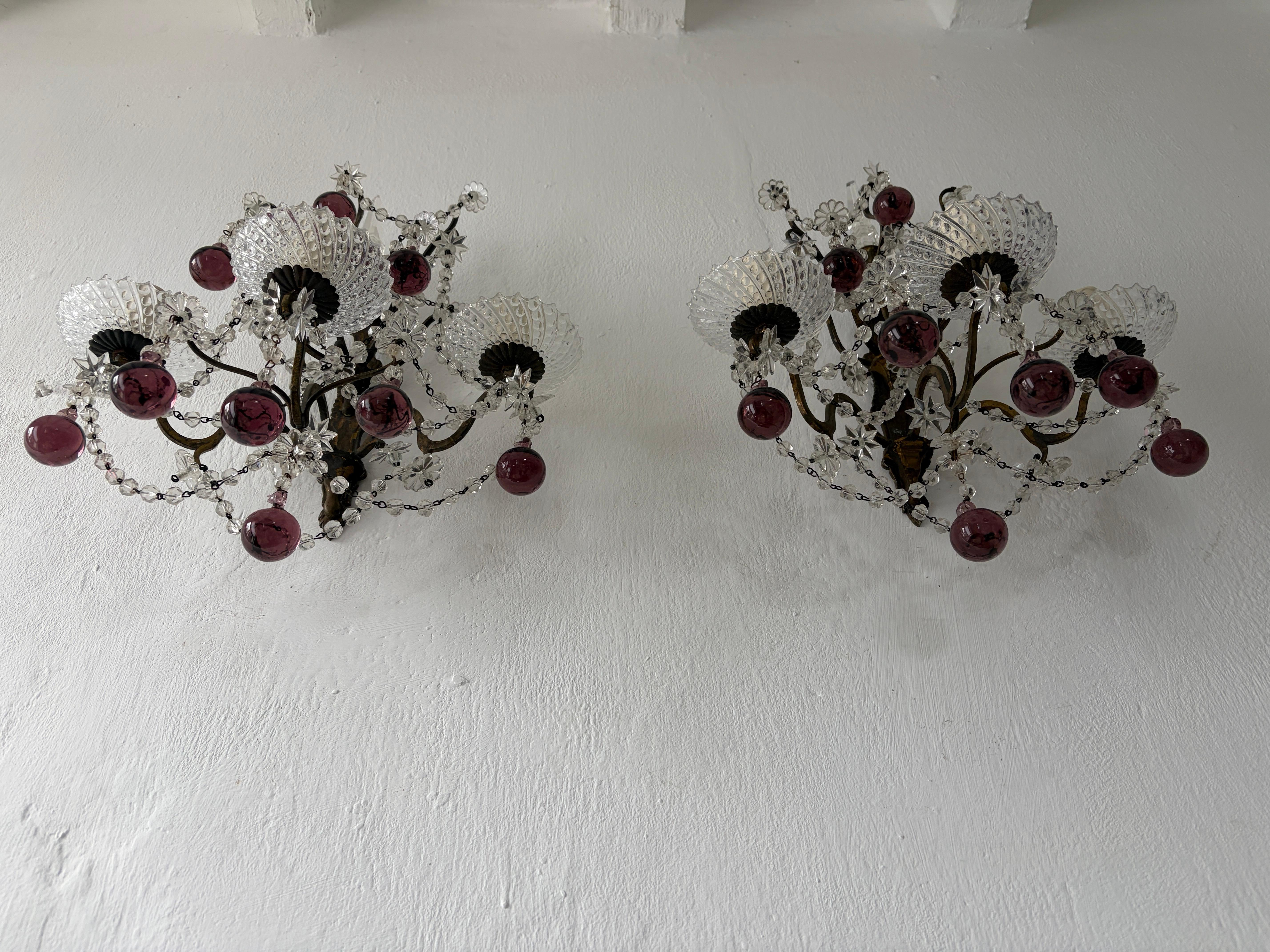 Housing three lights each. Sitting in beautiful rare crystal cups.  Heavy bronze with perfect patina.  Swags of crystal beads, florets and stars all in crystal.  Rare amethyst Murano balls.  Spear on top.  Will be rewired with certified UL US