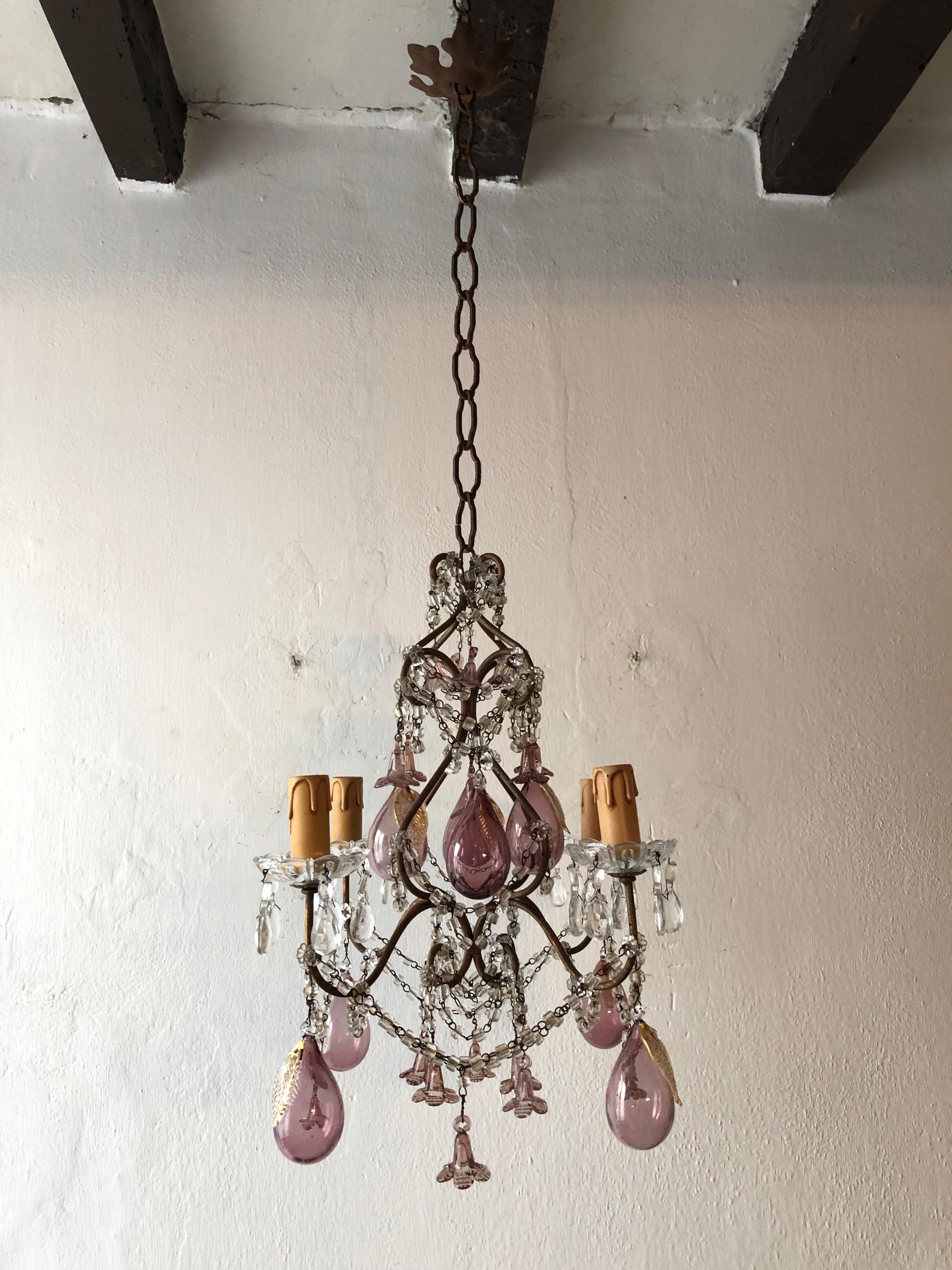 One of a kind 4 lights, sitting in crystal bobeches dripping with crystal prisms. Rewired and ready to hang. Adorning 8 rare huge Murano blown amethyst pears and flowers. Swags of macaroni beads throughout. Adding another 12 inches of original chain